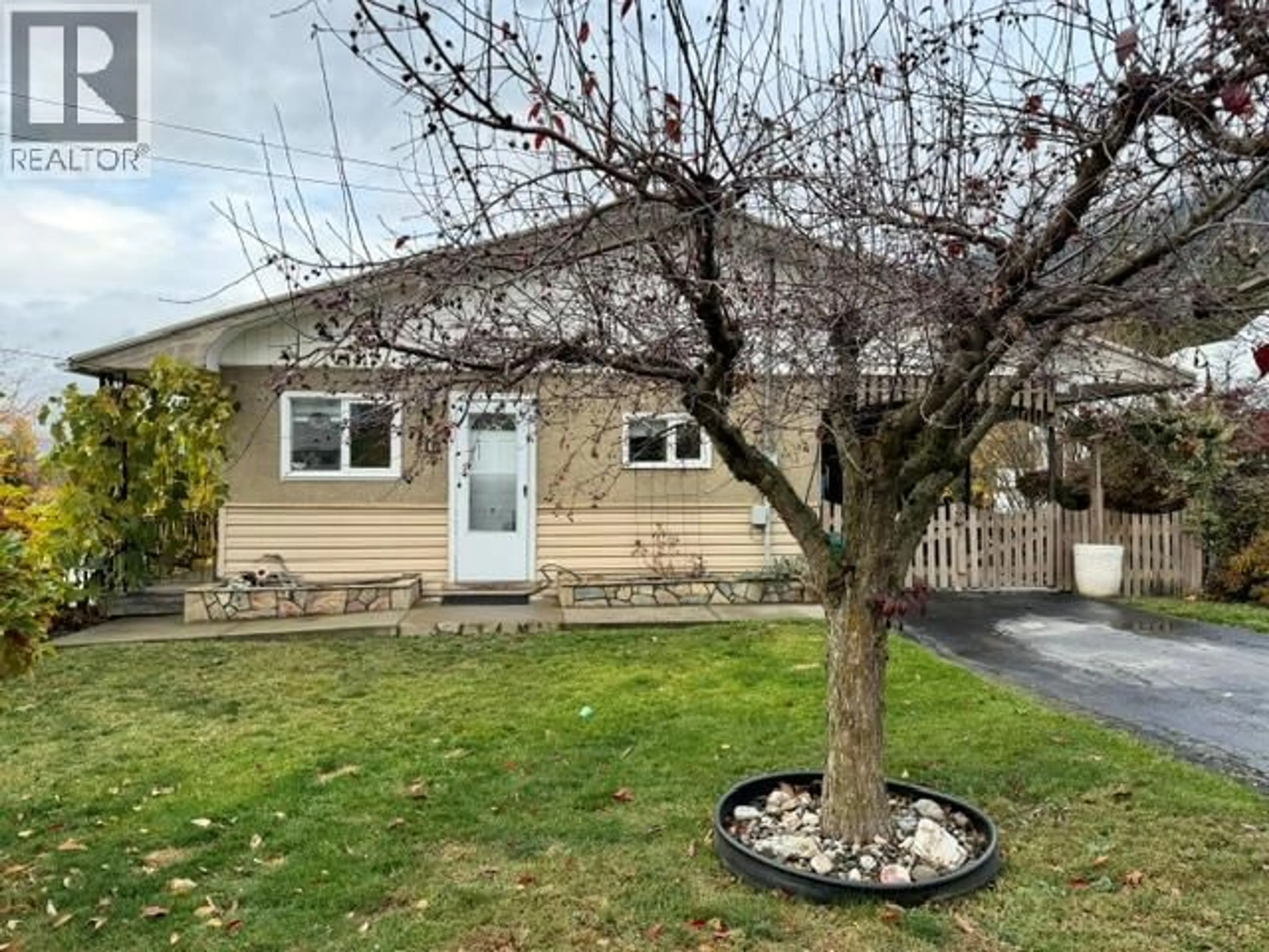 A pic from outside/outdoor area/front of a property/back of a property/a pic from drone, street for 710 IBBITSON STREET, Creston British Columbia V0B1G4