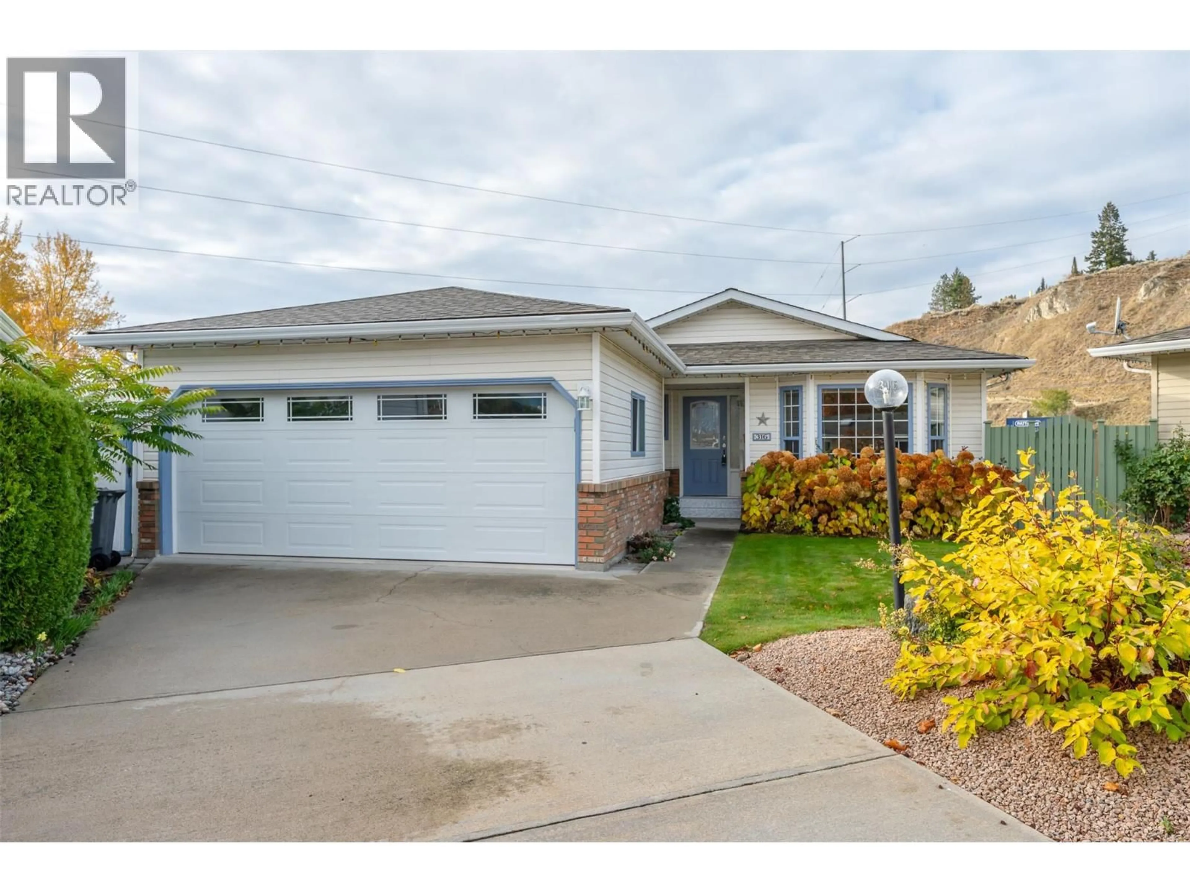 Home with vinyl exterior material, street for 316 FALCON PLACE, Penticton British Columbia V2A8K6