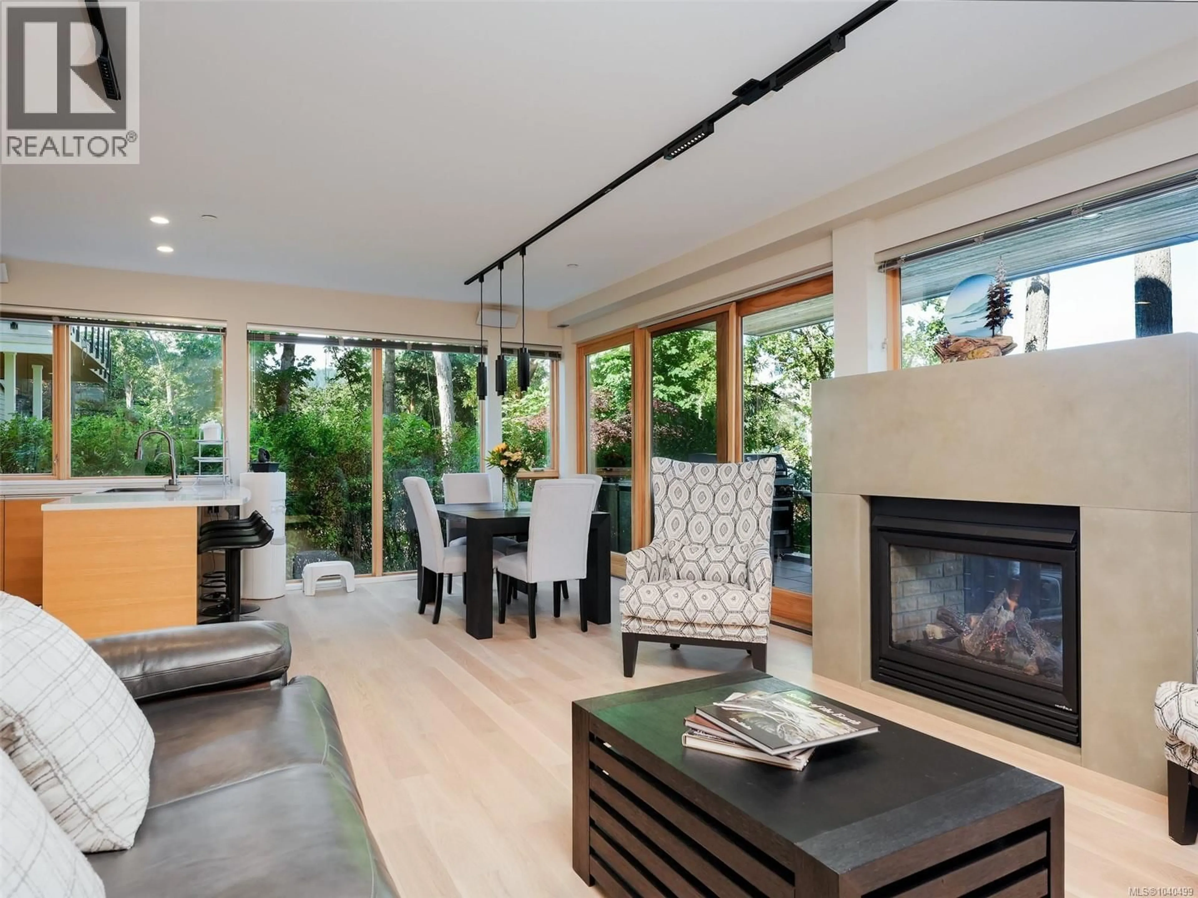 Living room with furniture, wood/laminate floor for 101 - 851 VERDIER AVENUE, Central Saanich British Columbia V8M1C5