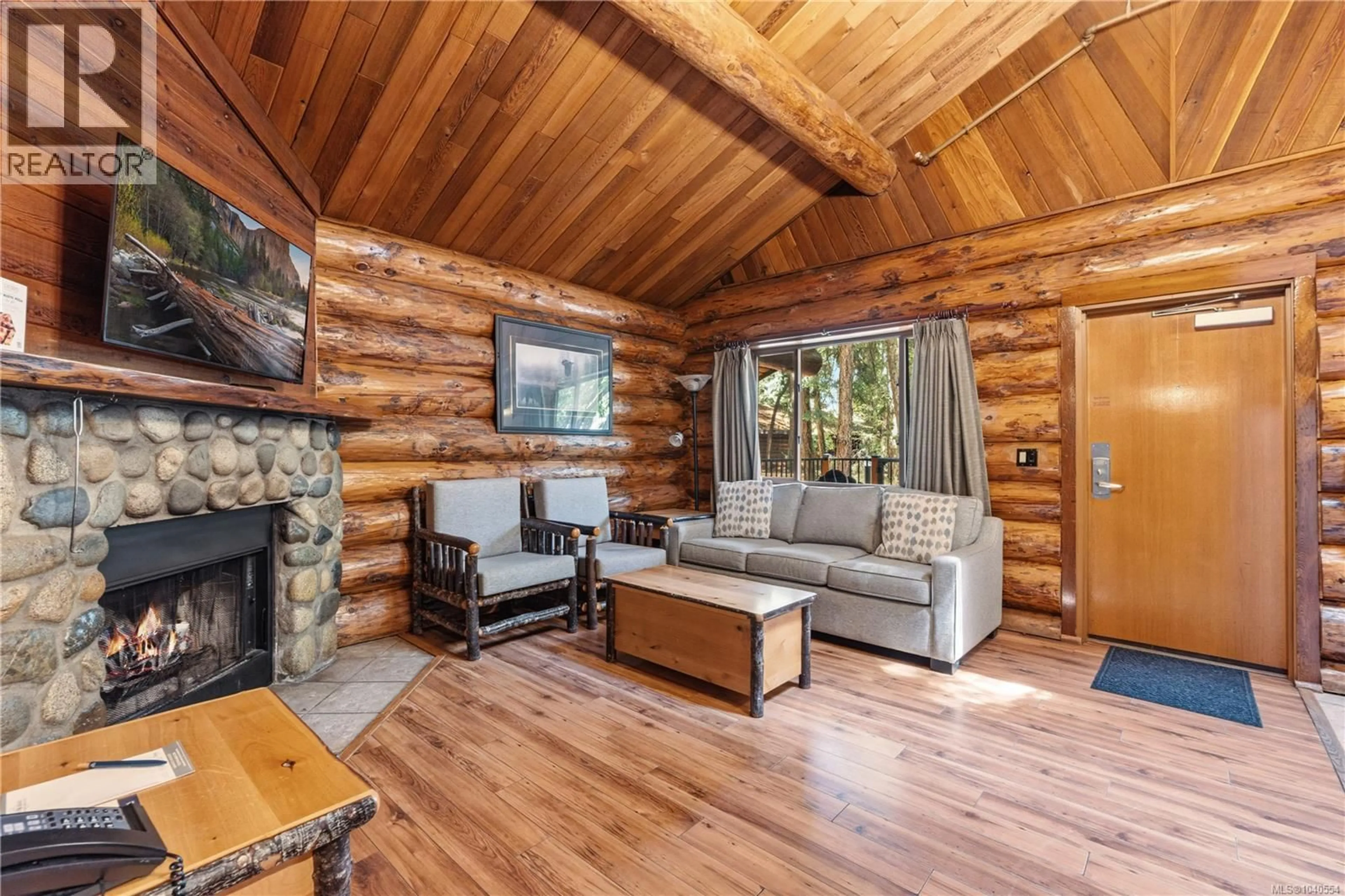 Living room with furniture, wood/laminate floor for 432 - 1155 RESORT DRIVE, Parksville British Columbia V9P2E3