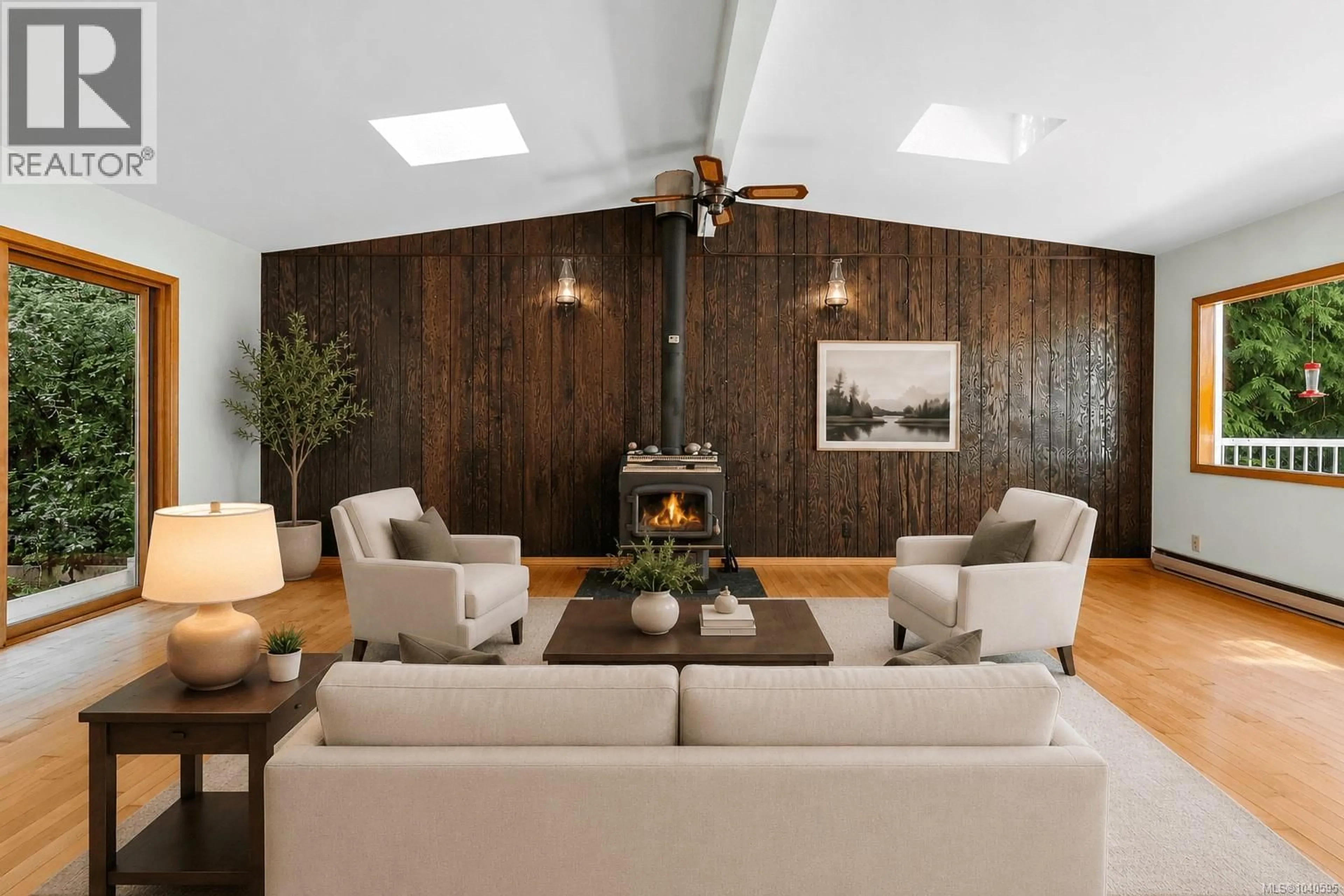 Living room with furniture, wood/laminate floor for 1356 LANDS END ROAD, North Saanich British Columbia V8L5K1