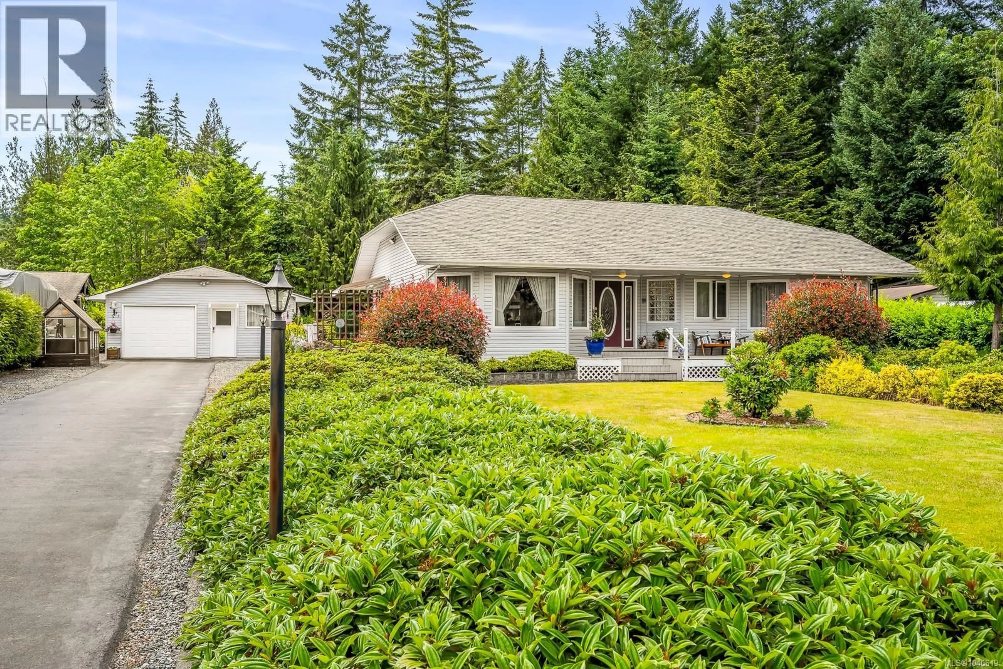 Home with vinyl exterior material, street for 6531 MYSTERY BEACH ROAD, Fanny Bay British Columbia V0R1W0