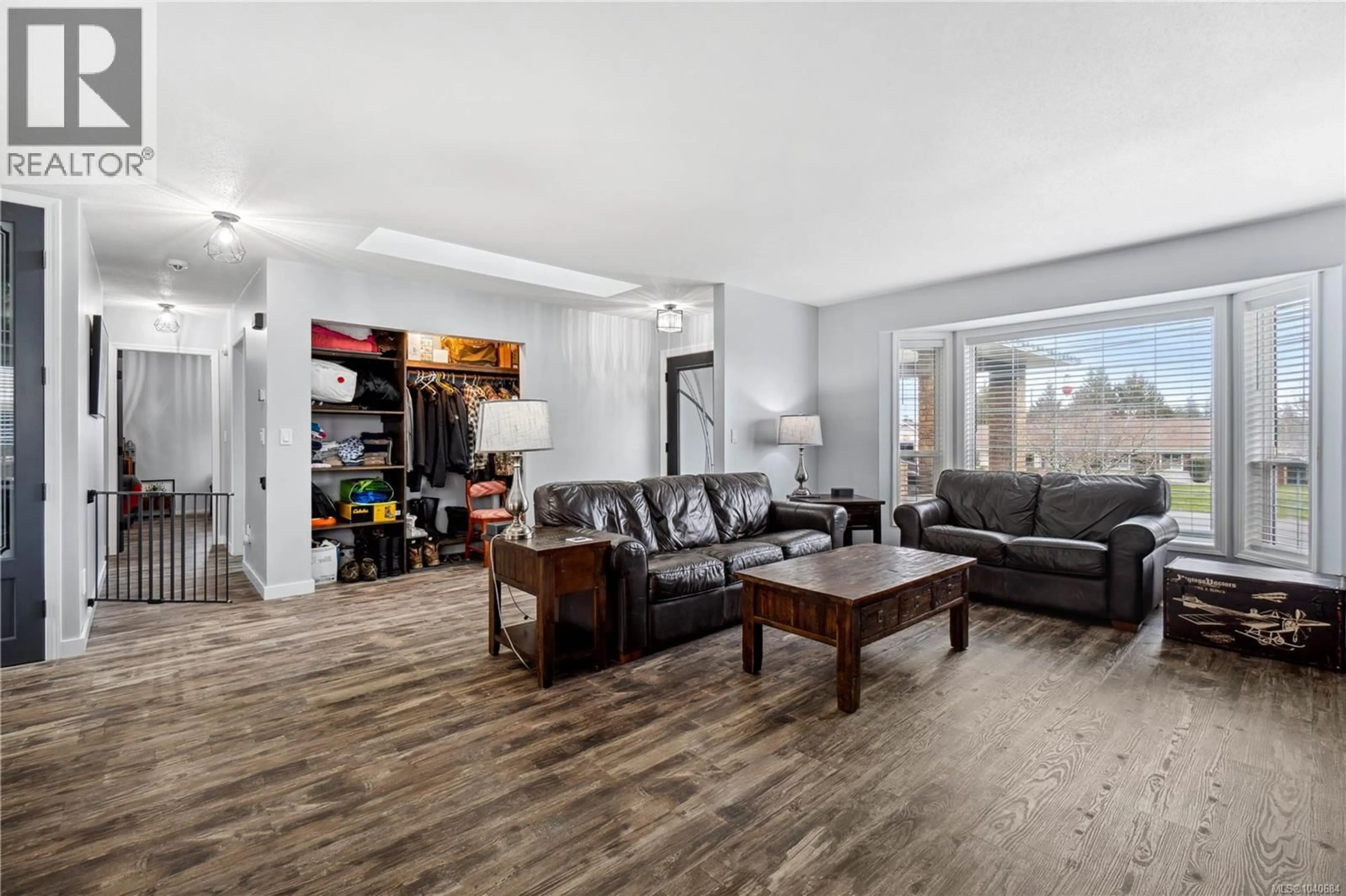 Living room with furniture, wood/laminate floor for 874 ABERDEEN DRIVE, Parksville British Columbia V9P2L9