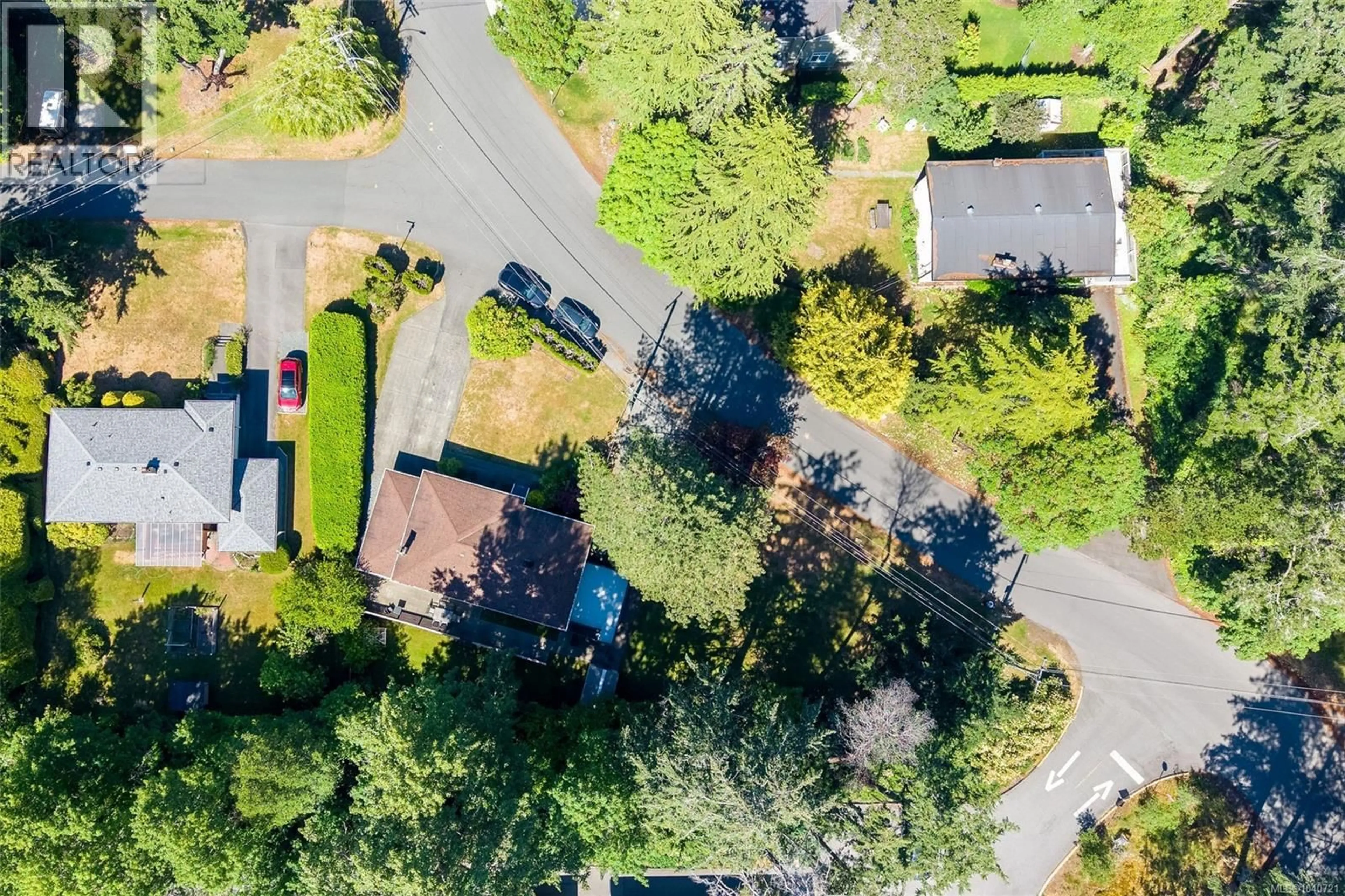 A pic from outside/outdoor area/front of a property/back of a property/a pic from drone, street for 3990 HARO ROAD, Saanich British Columbia V8N4A9