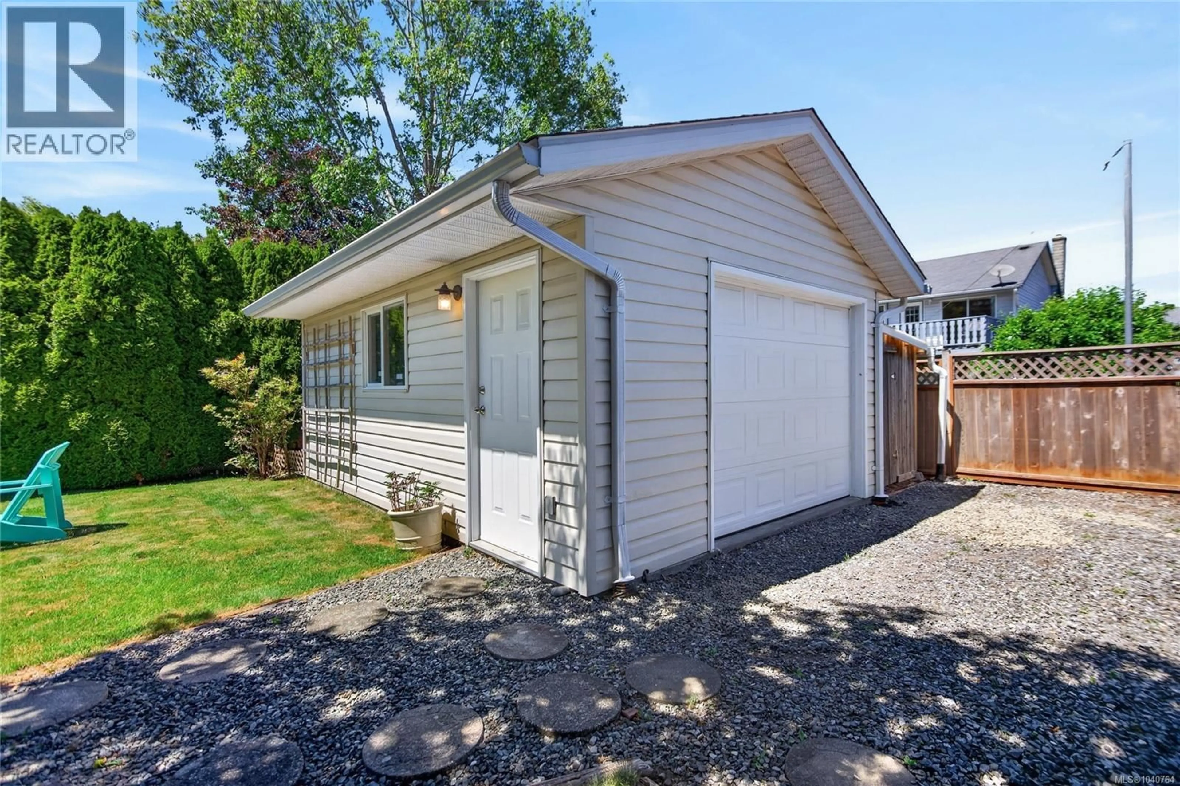 Home with vinyl exterior material, street for 677 SOMENOS DRIVE, Comox British Columbia V9M1B5