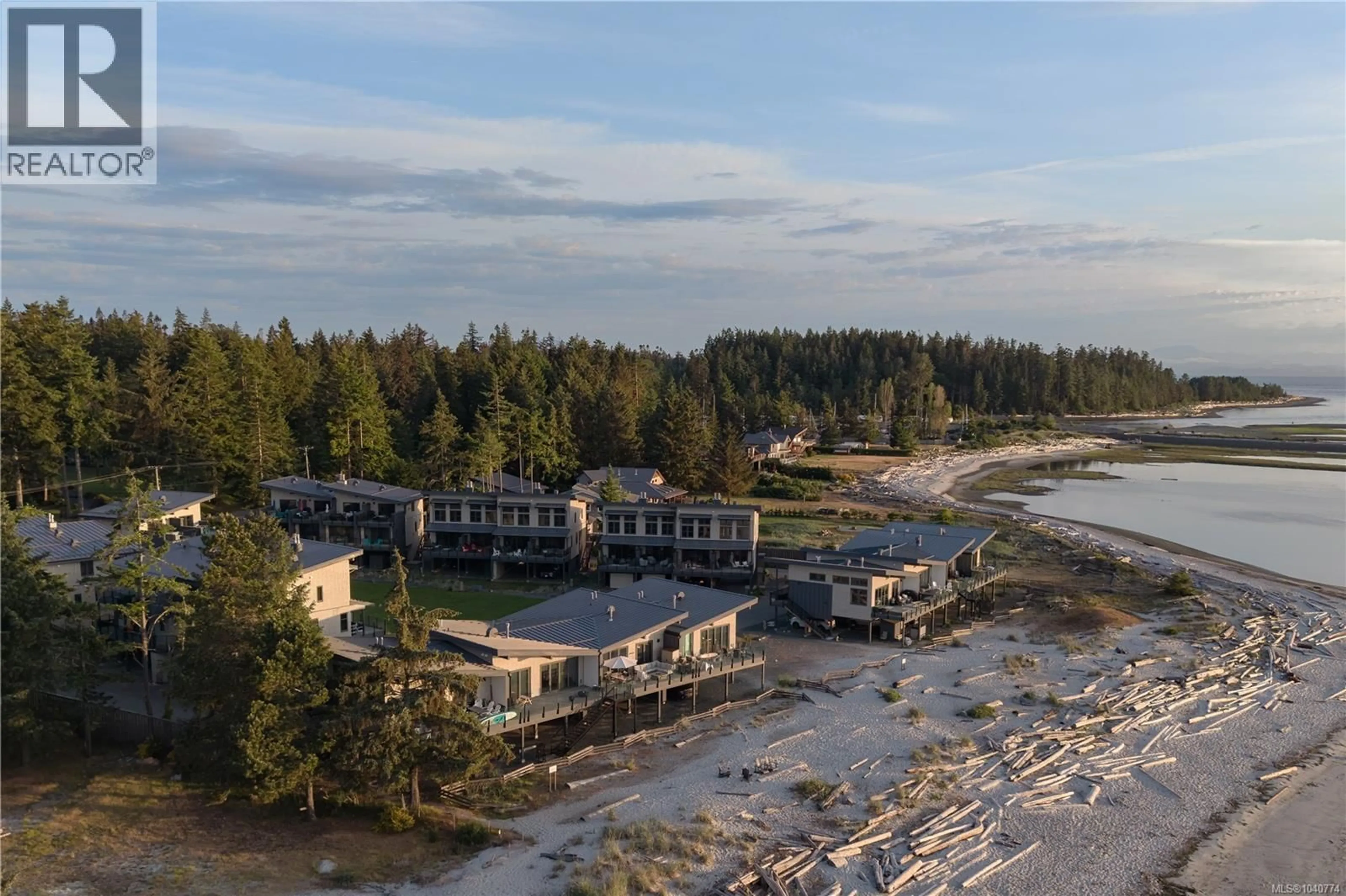 A pic from outside/outdoor area/front of a property/back of a property/a pic from drone, water/lake/river/ocean view for 4 - 9022 CLARKSON AVENUE, Black Creek British Columbia V9J1B2