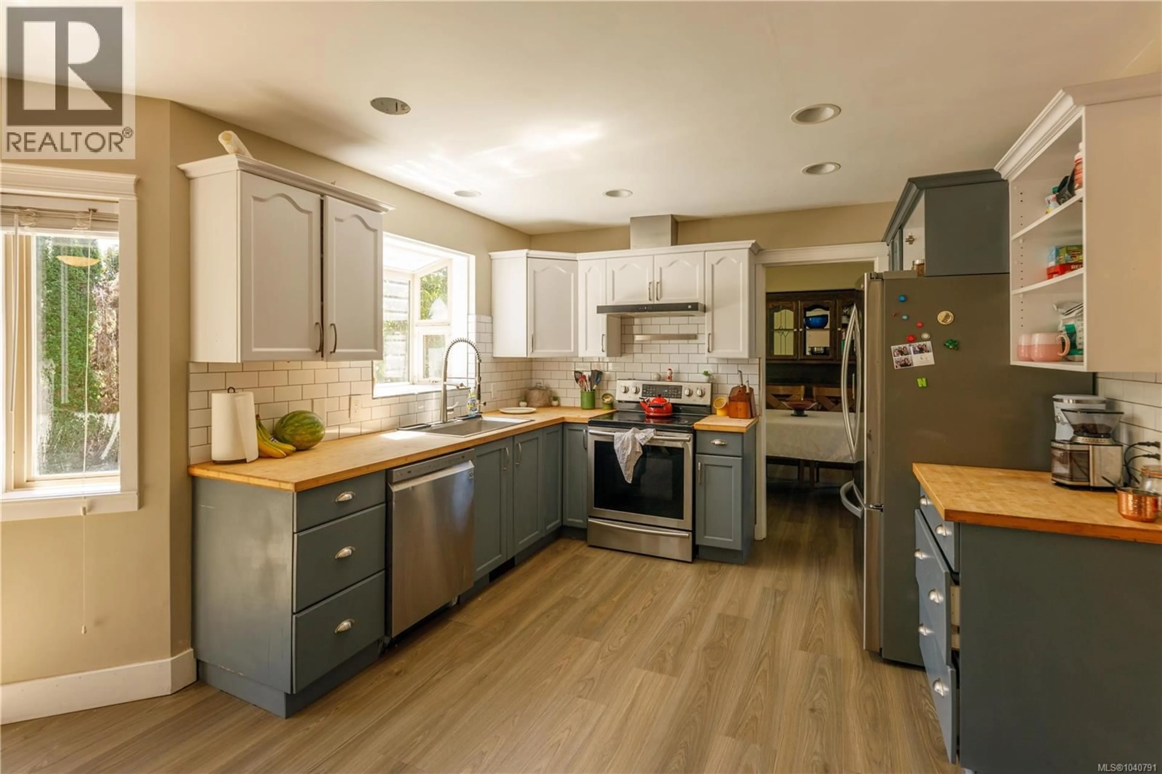 Open concept kitchen, wood/laminate floor for 6651 JENKINS ROAD, Nanaimo British Columbia V9T6J3