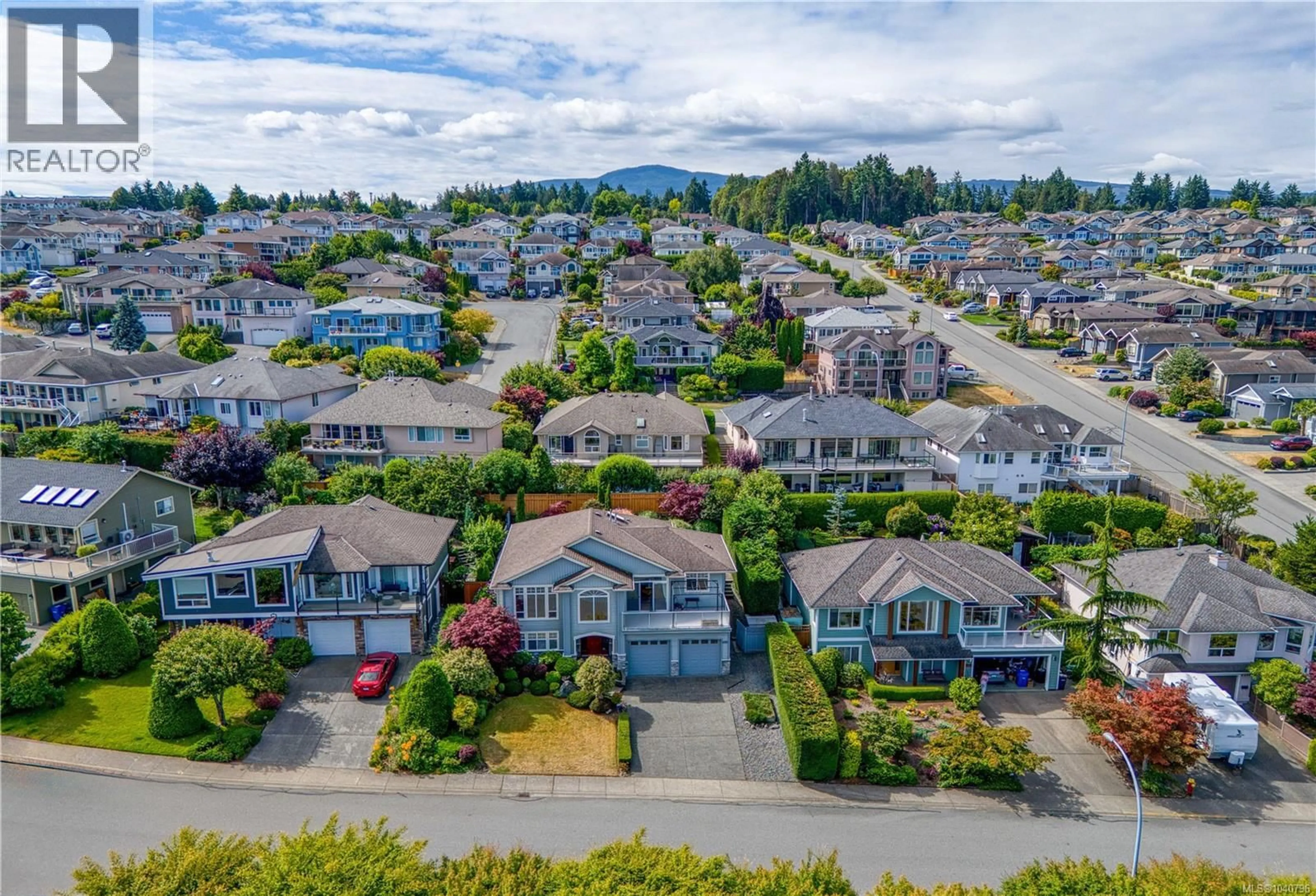 A pic from outside/outdoor area/front of a property/back of a property/a pic from drone, mountain view for 6381 ICARUS DRIVE, Nanaimo British Columbia V9V1P2