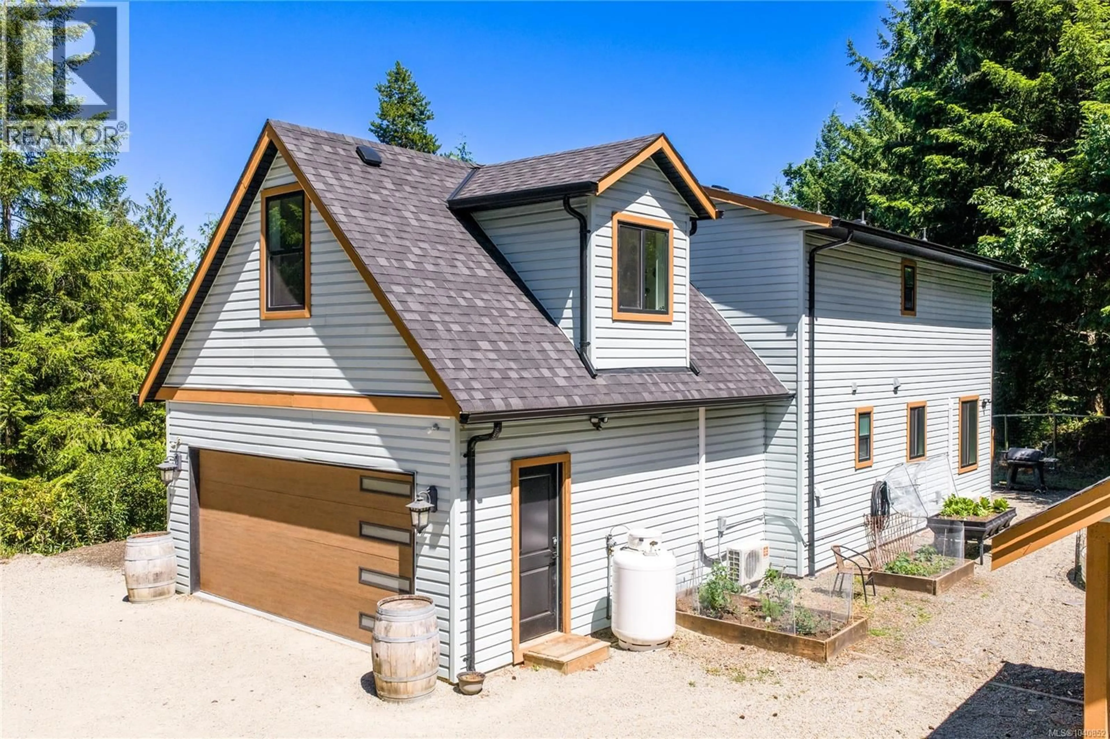 A pic from outside/outdoor area/front of a property/back of a property/a pic from drone, street for 1691 MEADOWOOD WAY, Qualicum Beach British Columbia V9K2S3