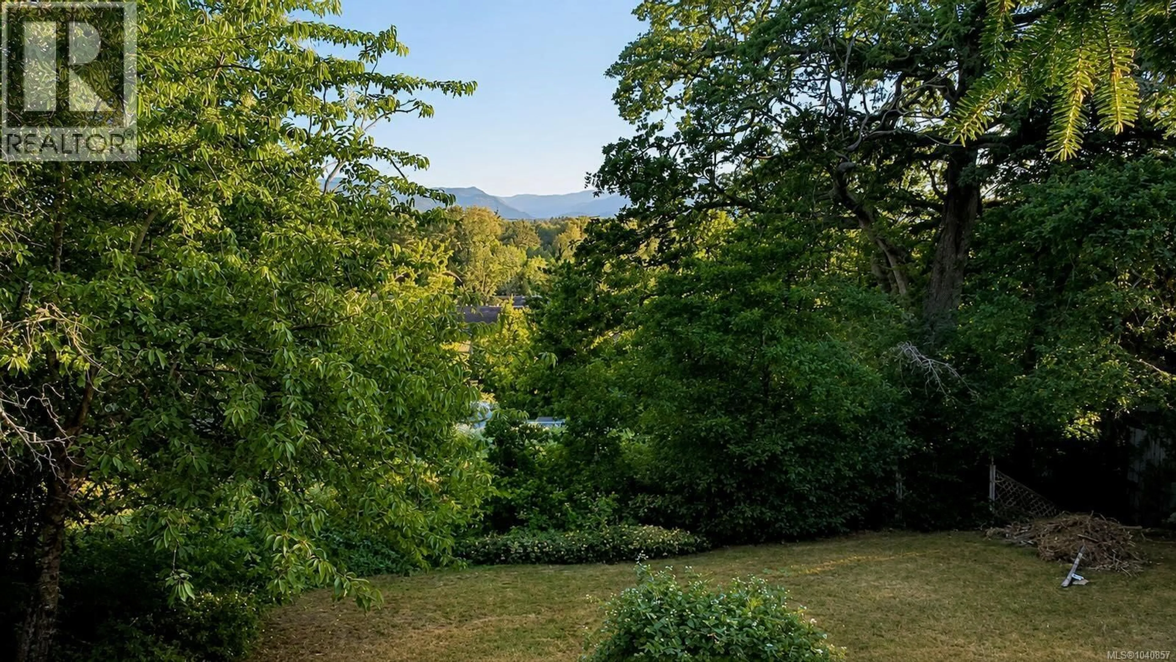 A pic from outside/outdoor area/front of a property/back of a property/a pic from drone, forest/trees view for 4649 MCQUILLAN ROAD, Courtenay British Columbia V9N3T6