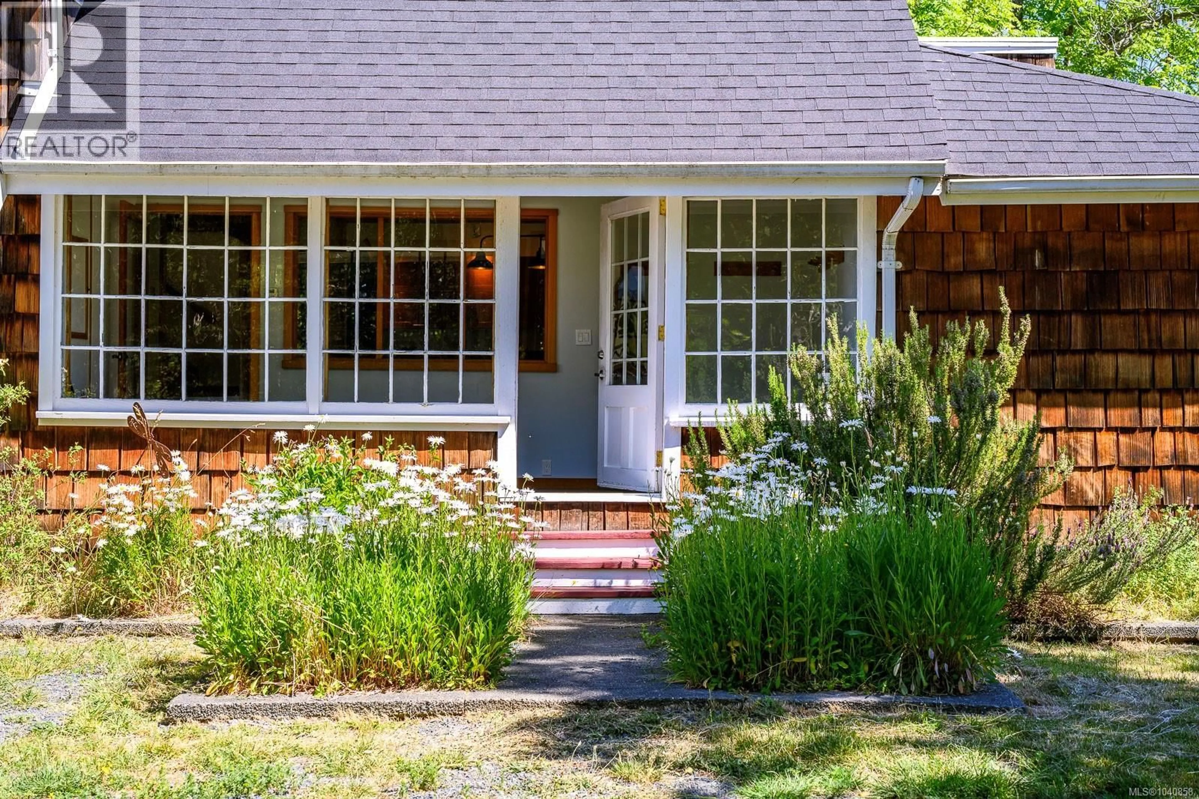 Home with brick exterior material, street for 500 CENTRAL ROAD, Hornby Island British Columbia V0R1Z0