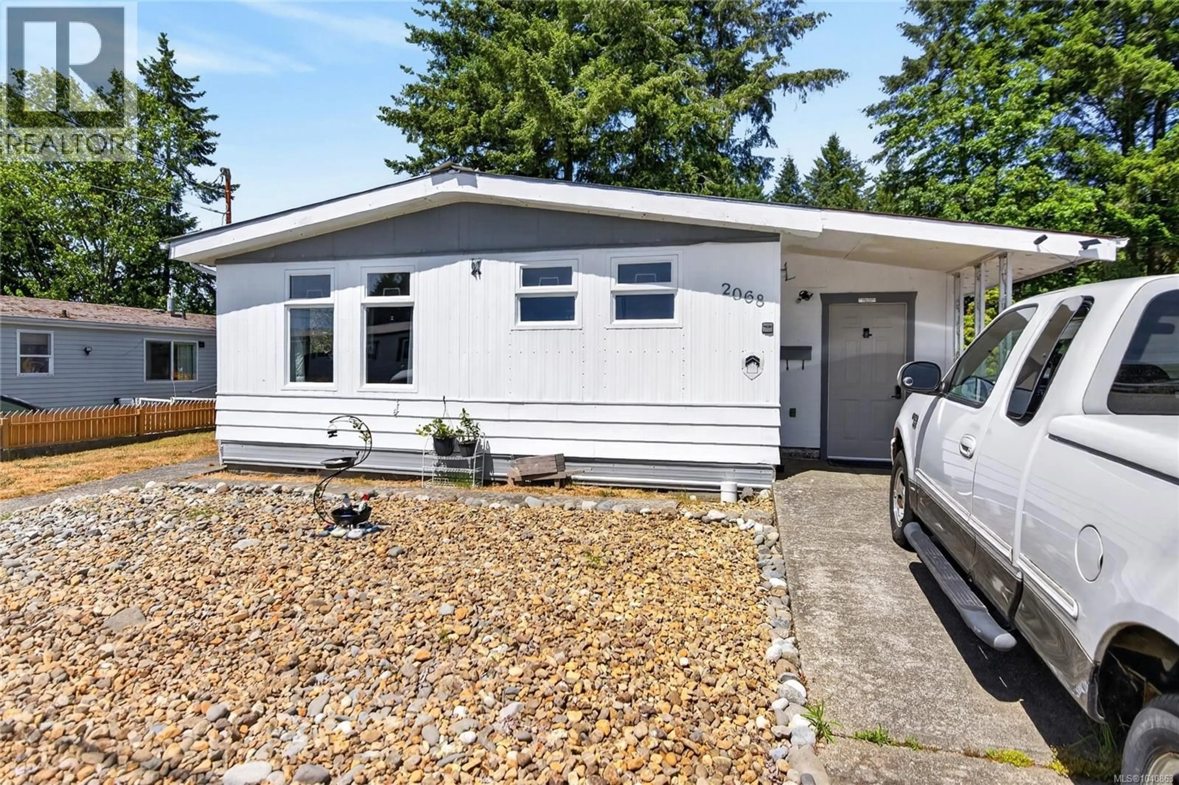 Home with vinyl exterior material, street for 2068 4TH STREET EAST, Courtenay British Columbia V9N6V8