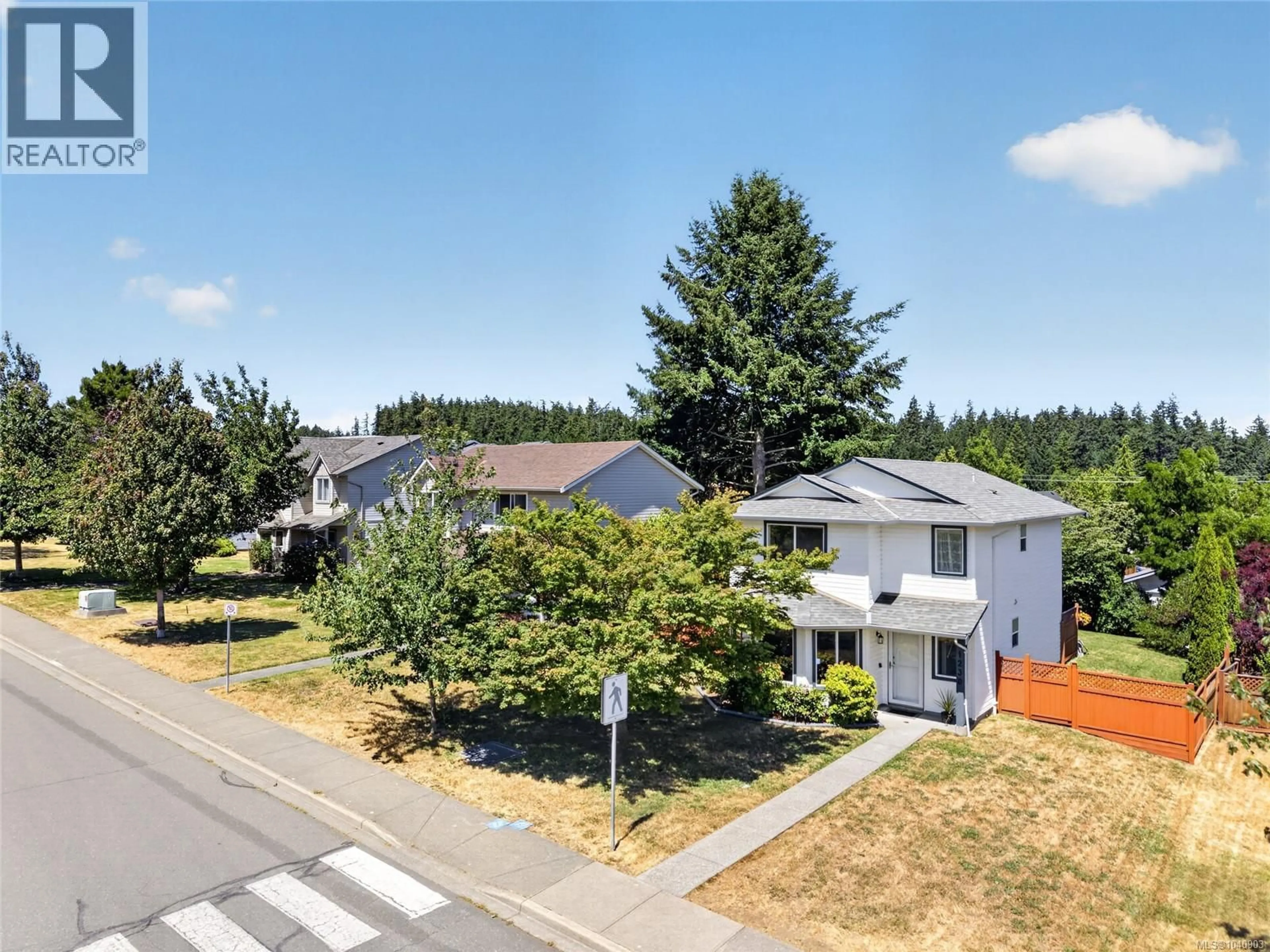 A pic from outside/outdoor area/front of a property/back of a property/a pic from drone, street for 1230 BECKTON DRIVE, Comox British Columbia V9M3R2