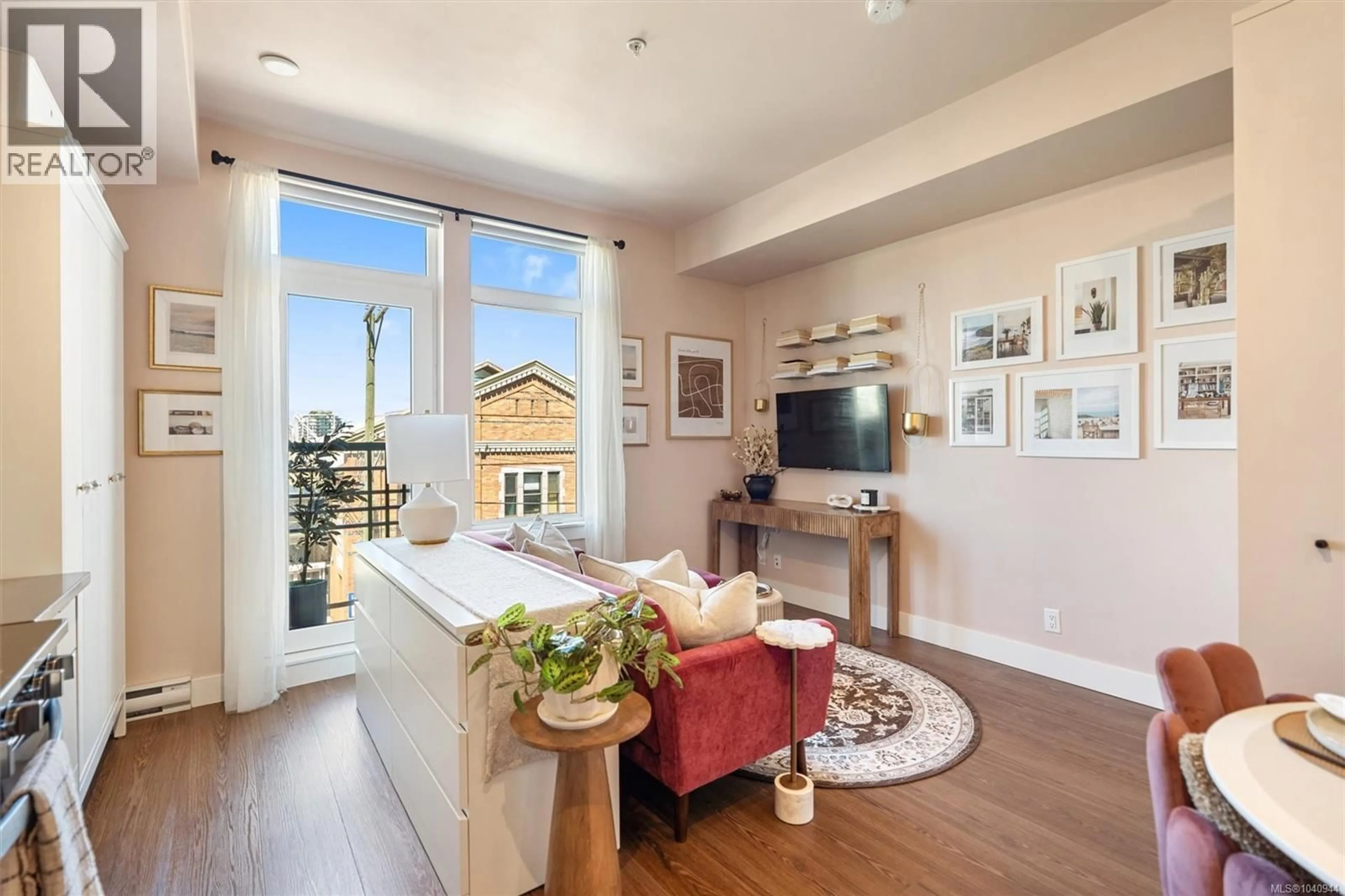 Living room with furniture, wood/laminate floor for 310 - 515 CHATHAM STREET, Victoria British Columbia V8T0C8