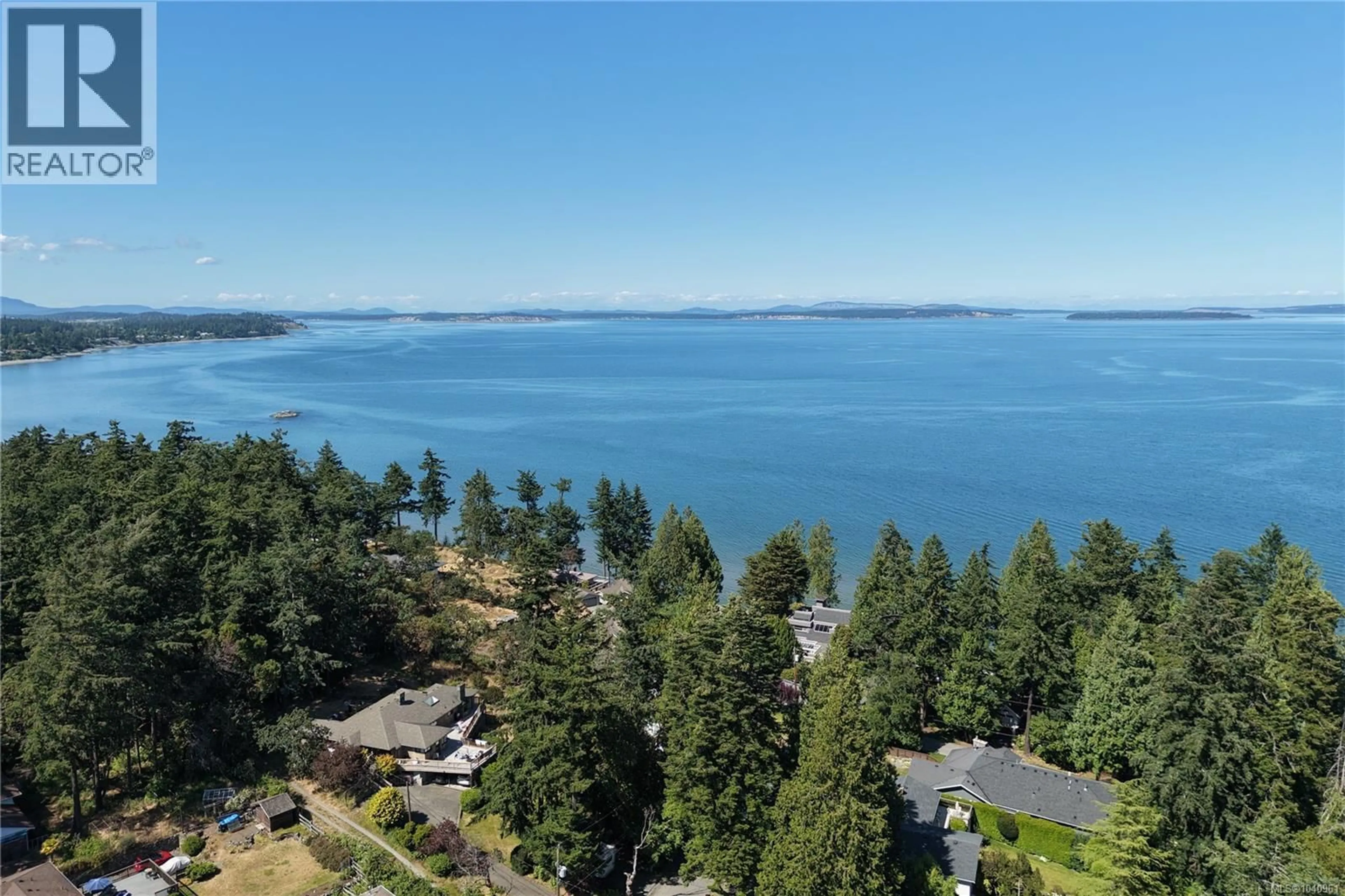 A pic from outside/outdoor area/front of a property/back of a property/a pic from drone, water/lake/river/ocean view for 4767 ELLIOT PLACE, Saanich British Columbia V8Y3E4
