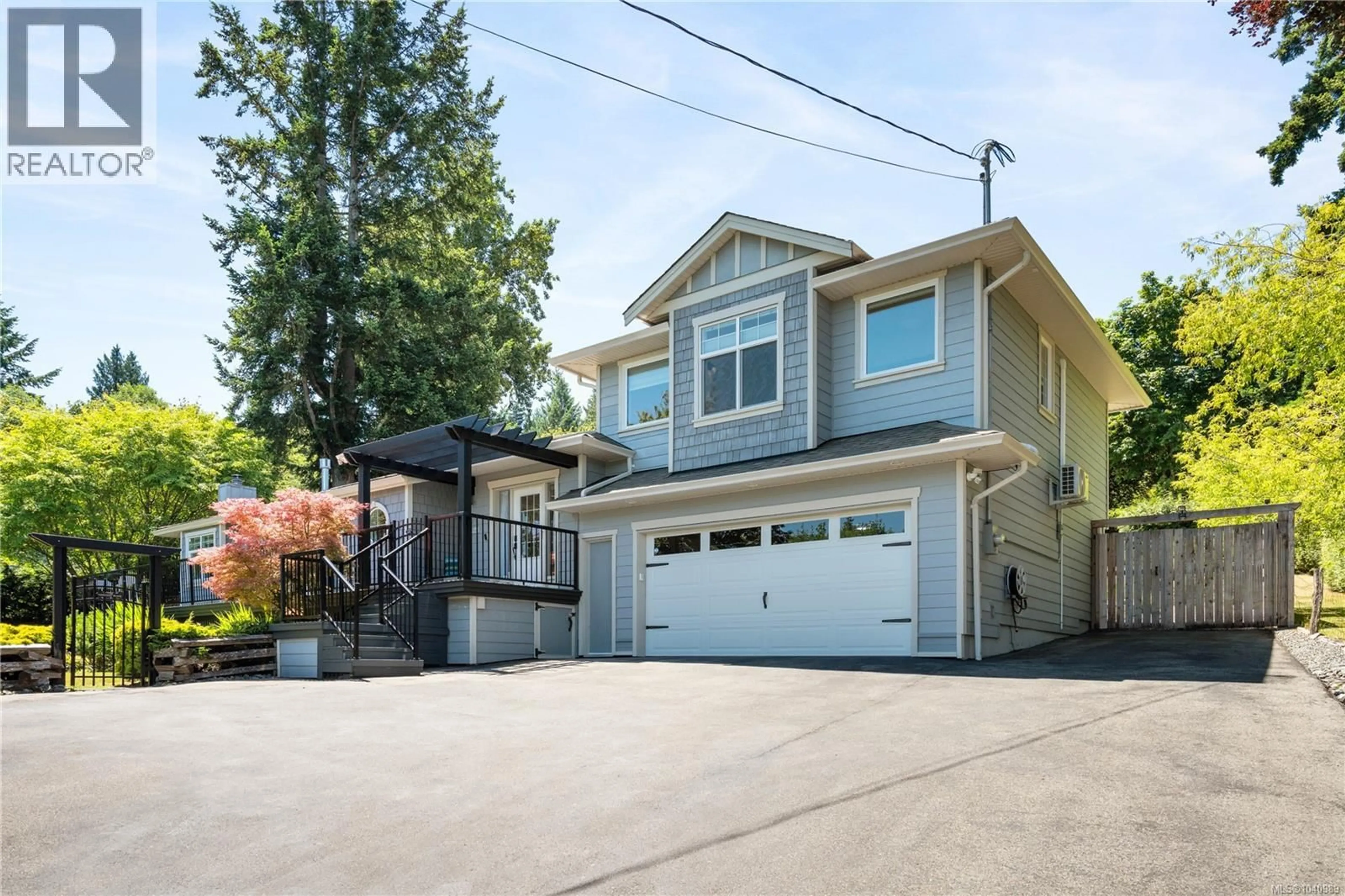 Home with vinyl exterior material, street for 2618 MILL BAY ROAD, Mill Bay British Columbia V8H1C9