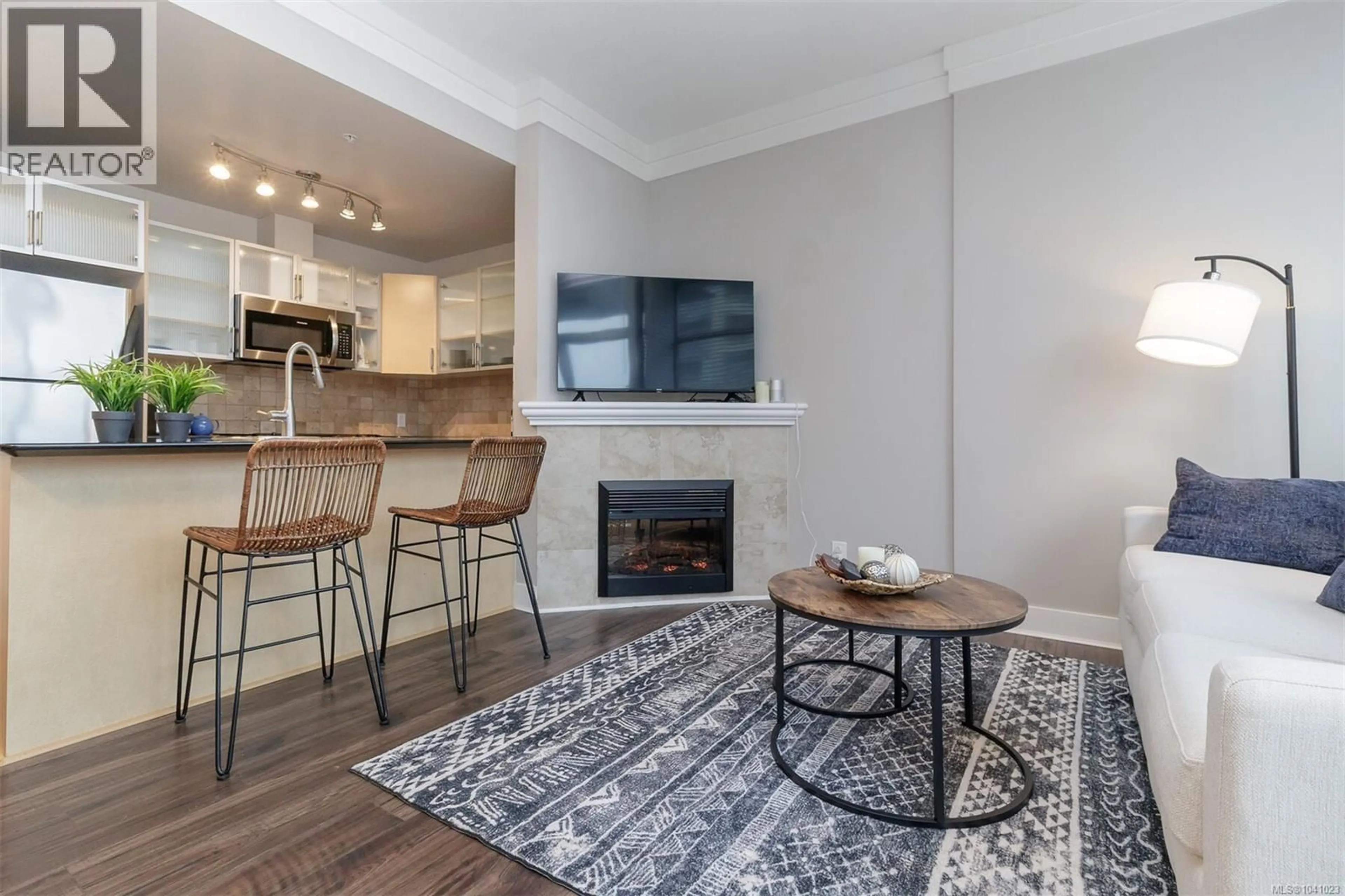 Living room with furniture, wood/laminate floor for 406 - 845 YATES STREET, Victoria British Columbia V8W4A3