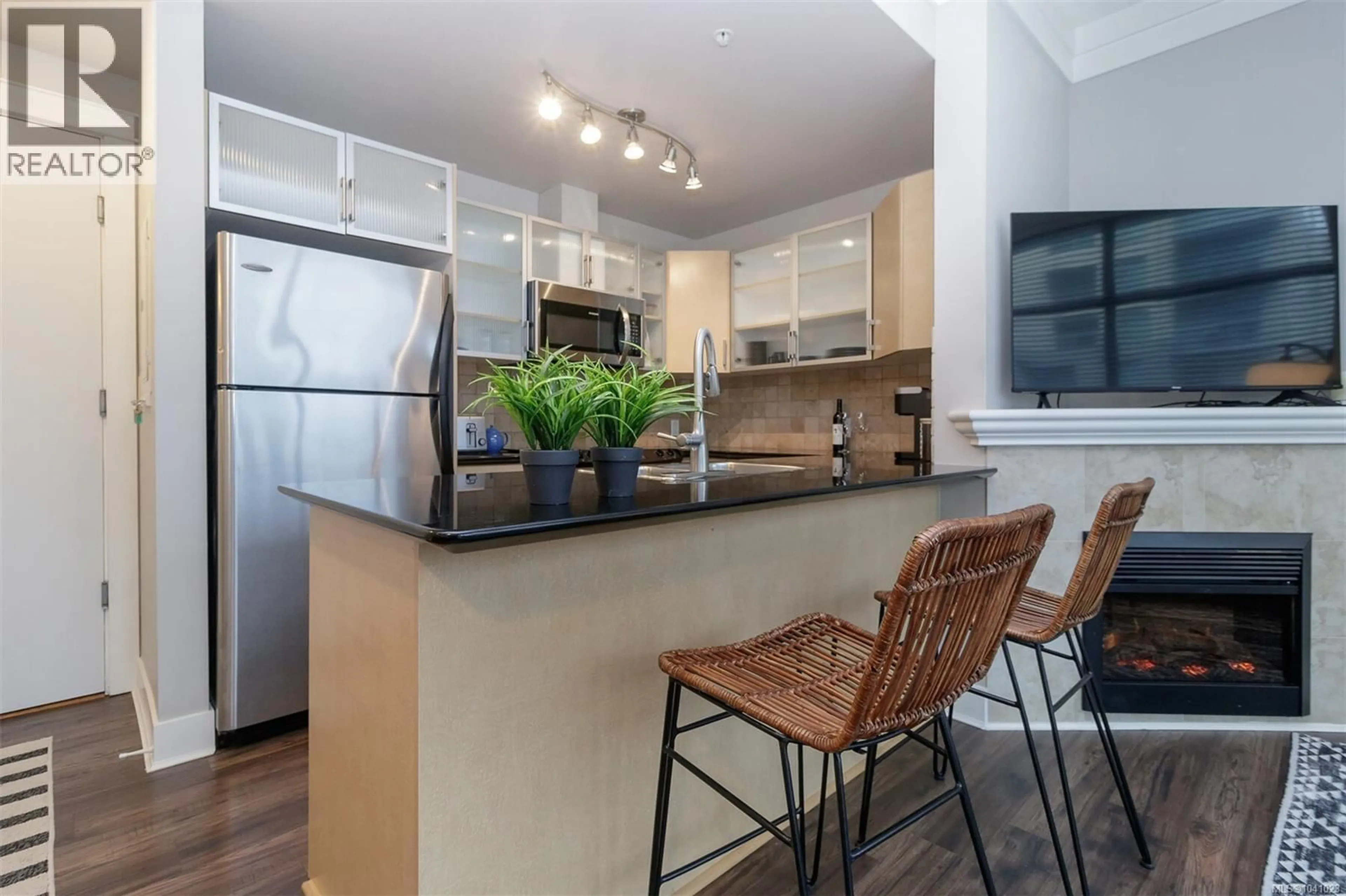 Open concept kitchen, wood/laminate floor for 406 - 845 YATES STREET, Victoria British Columbia V8W4A3