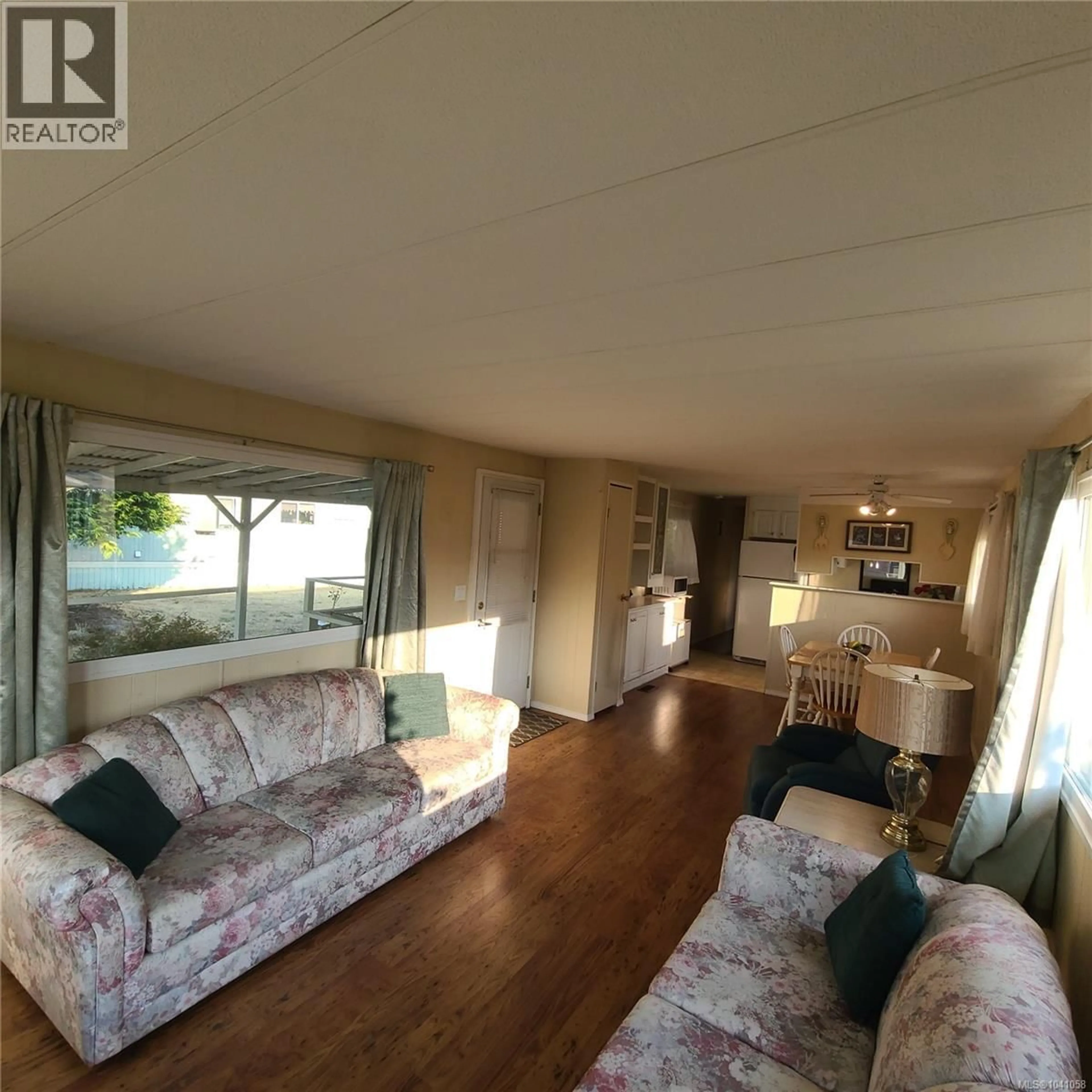 Living room with furniture, wood/laminate floor for 237 - 2885 BOYS ROAD, Duncan British Columbia V9L4Y9