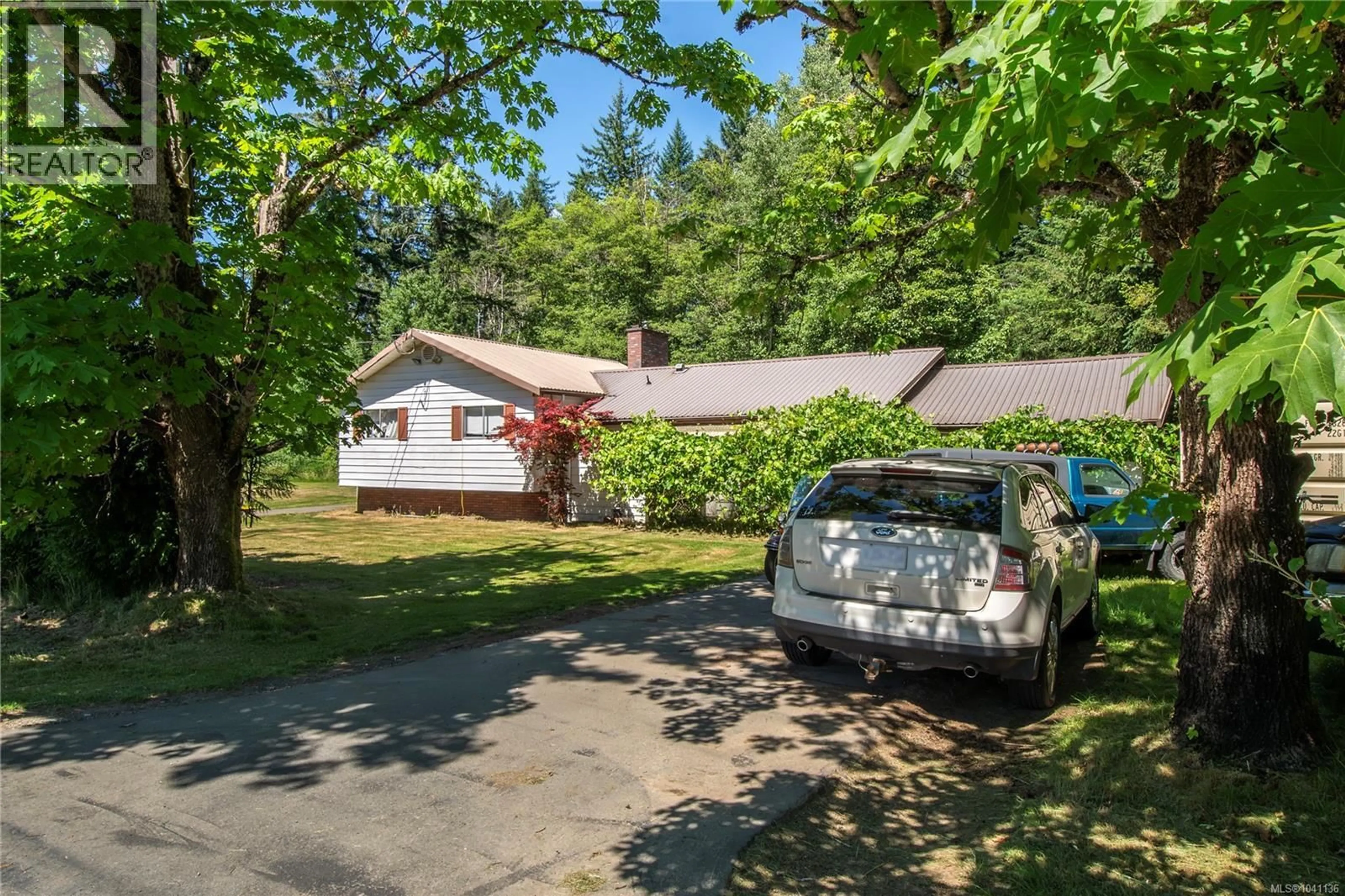 A pic from outside/outdoor area/front of a property/back of a property/a pic from drone, street for 7602 ISLAND HIGHWAY NORTH, Black Creek British Columbia V9J1G3
