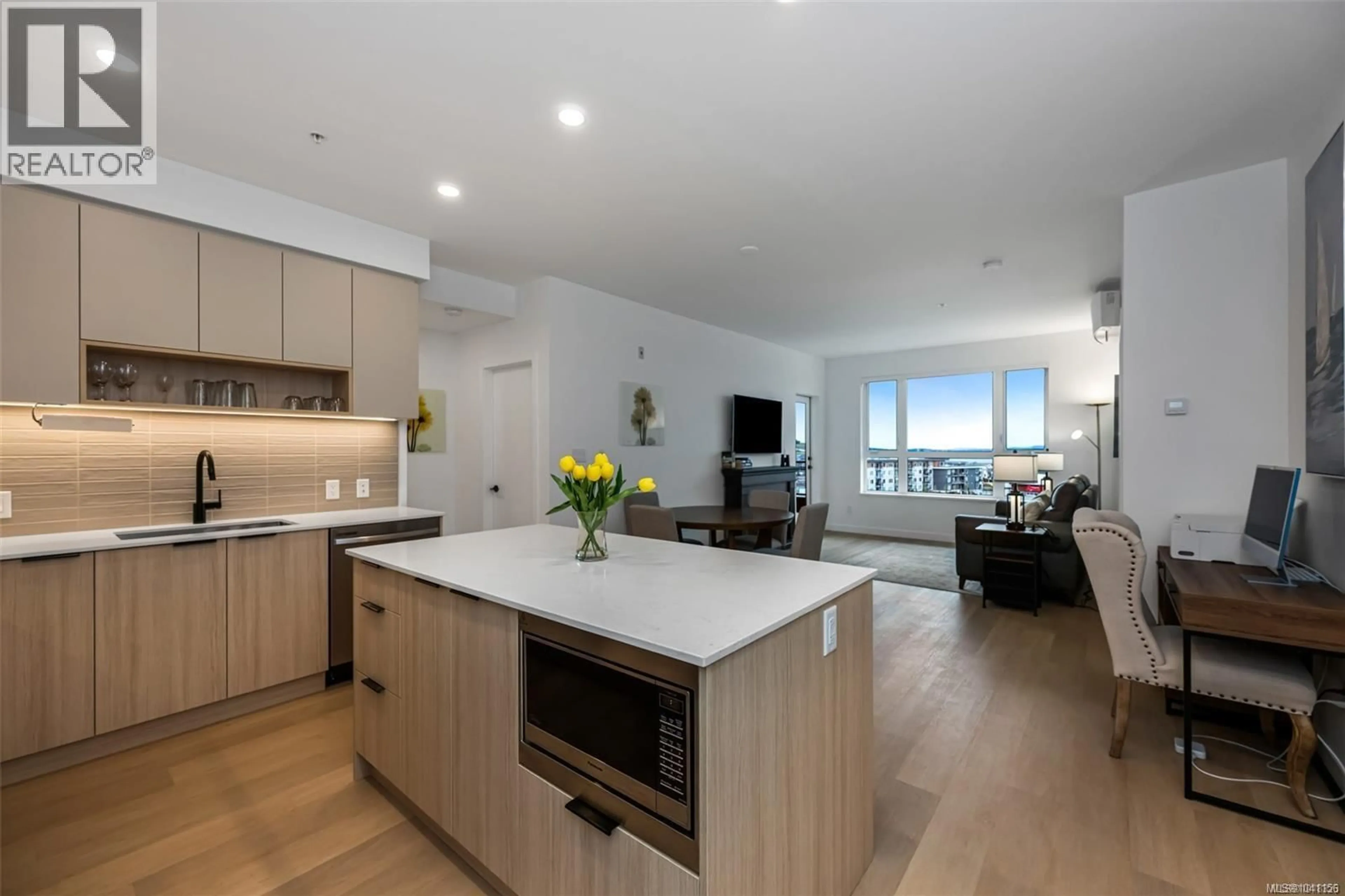Open concept kitchen, wood/laminate floor for 411 - 3564A RYDER HESJEDAL WAY, Colwood British Columbia V9C0V3