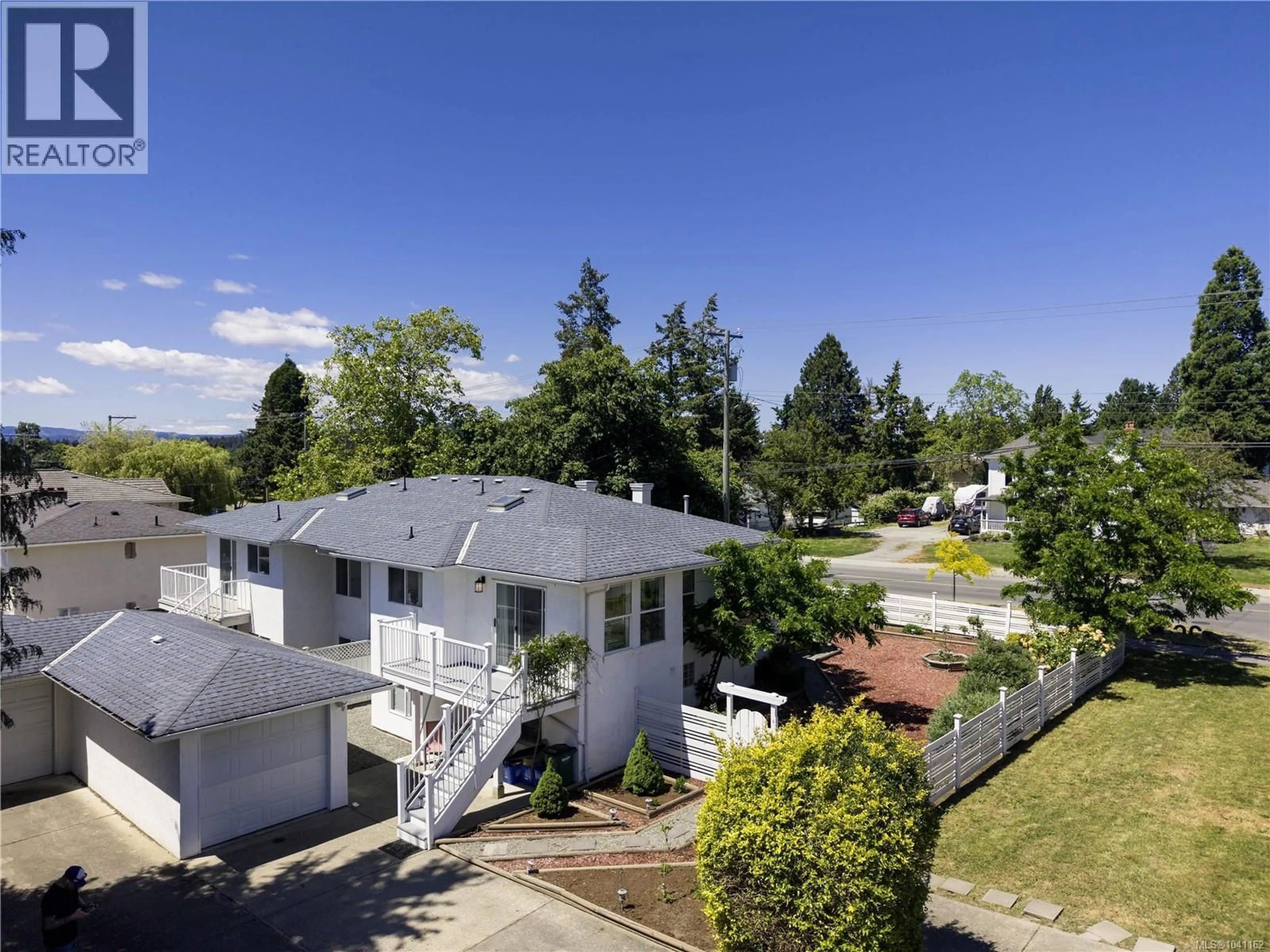 A pic from outside/outdoor area/front of a property/back of a property/a pic from drone, street for 1843 FELTHAM ROAD, Saanich British Columbia V8N2A4