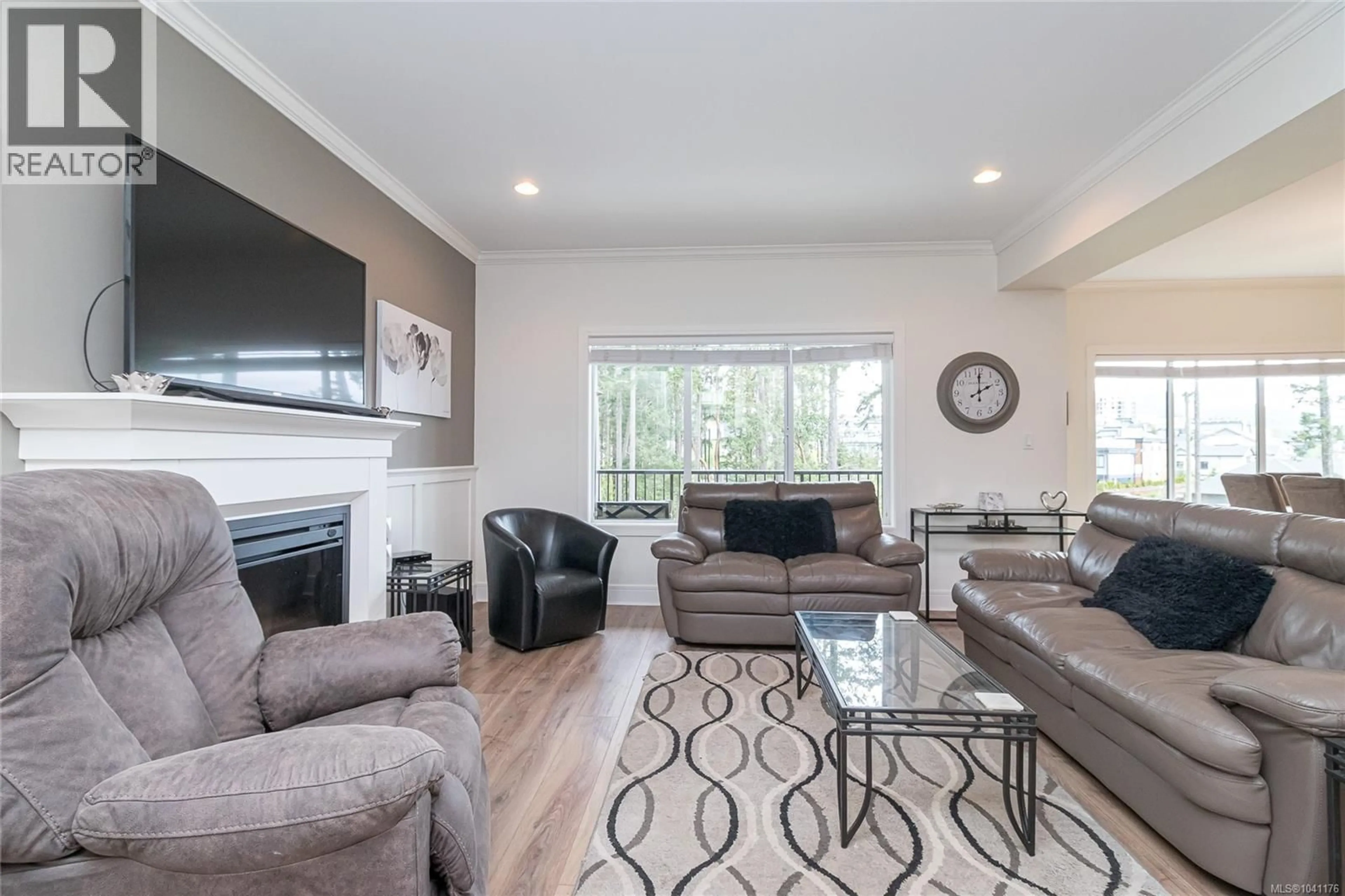 Living room with furniture, wood/laminate floor for 1166 BOMBARDIER CRESCENT, Langford British Columbia V9B0R2