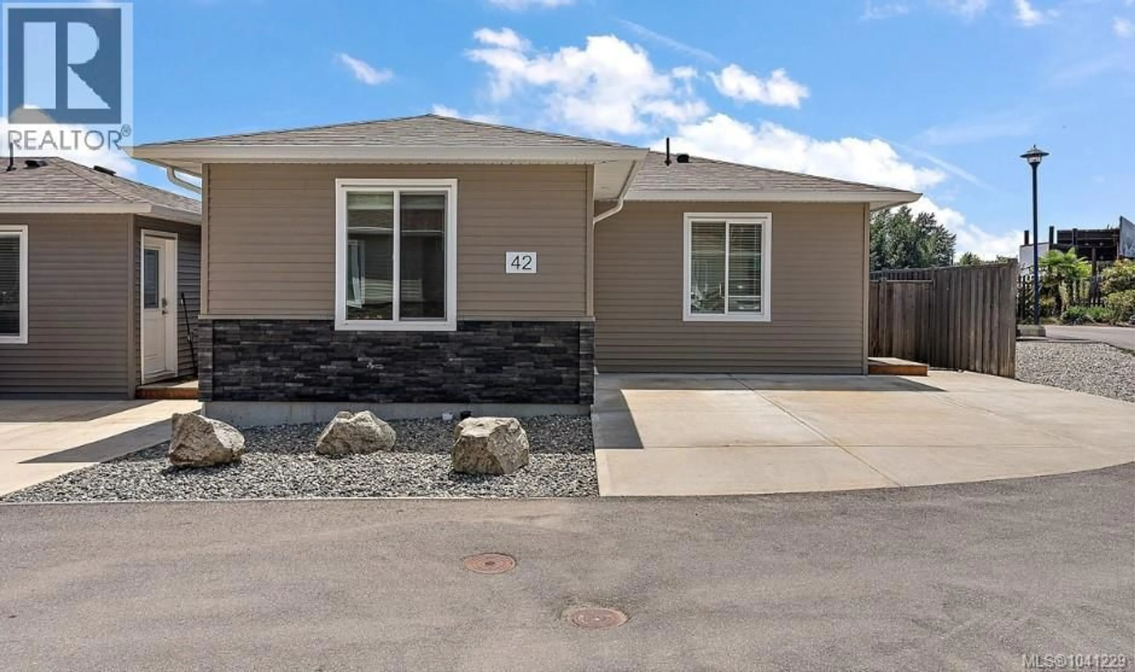 Home with vinyl exterior material, street for 42 - 7650 QWUC CHUS LANE, Central Saanich British Columbia V8M0B4