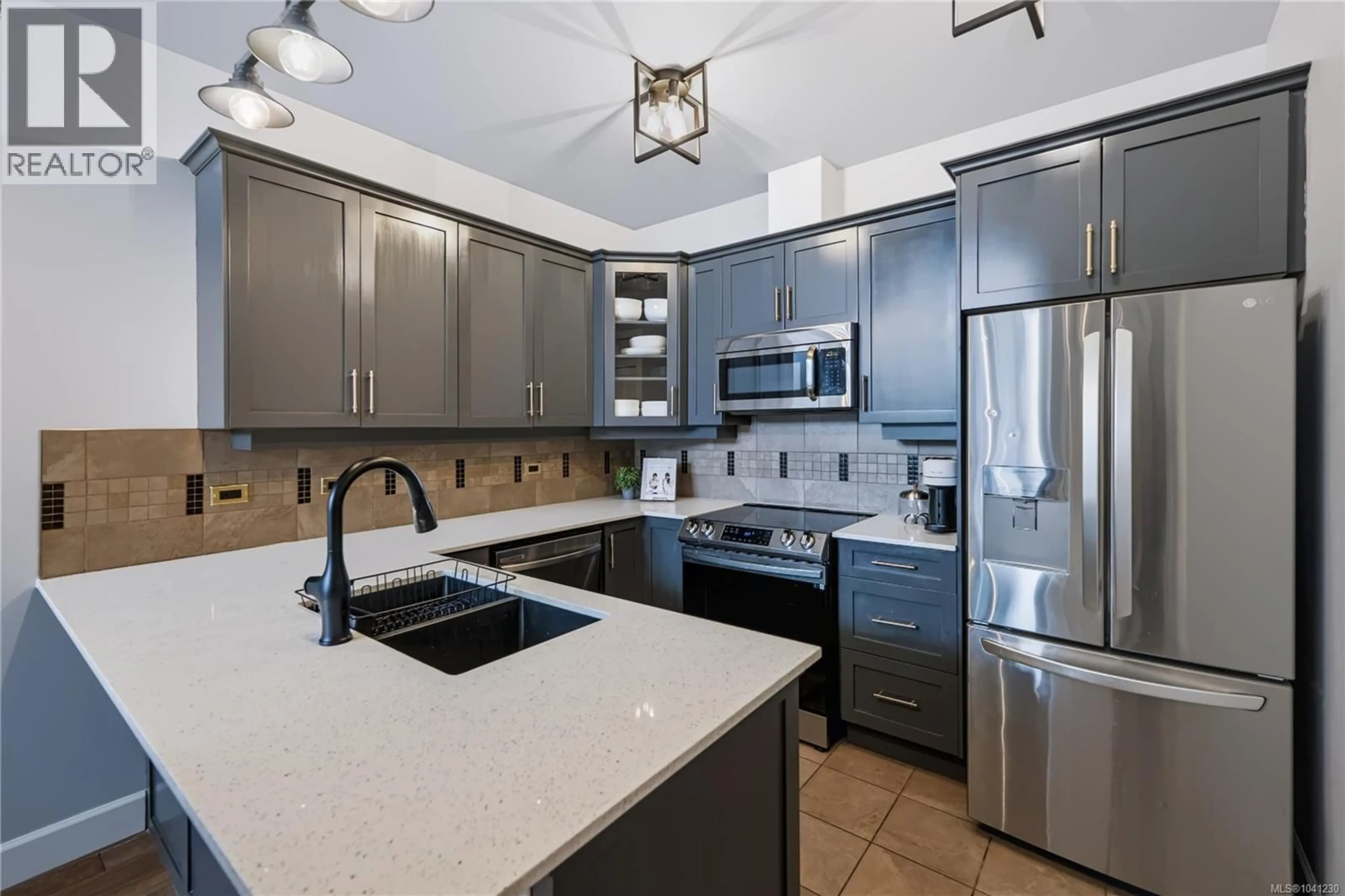 Open concept kitchen, ceramic/tile floor for 401 - 3226 JACKLIN ROAD SOUTHEAST, Langford British Columbia V9B0J5