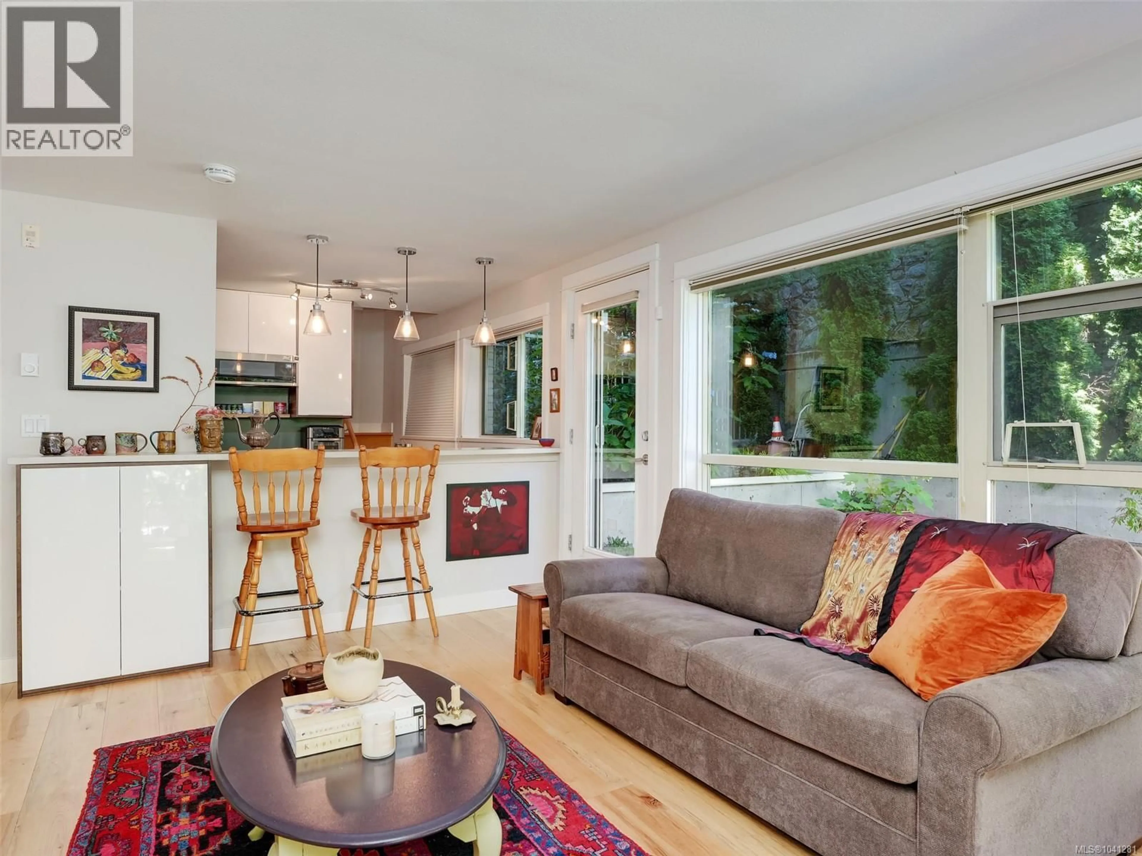 Open concept kitchen, wood/laminate floor for 109 - 1155 YATES STREET, Victoria British Columbia V8V3N1