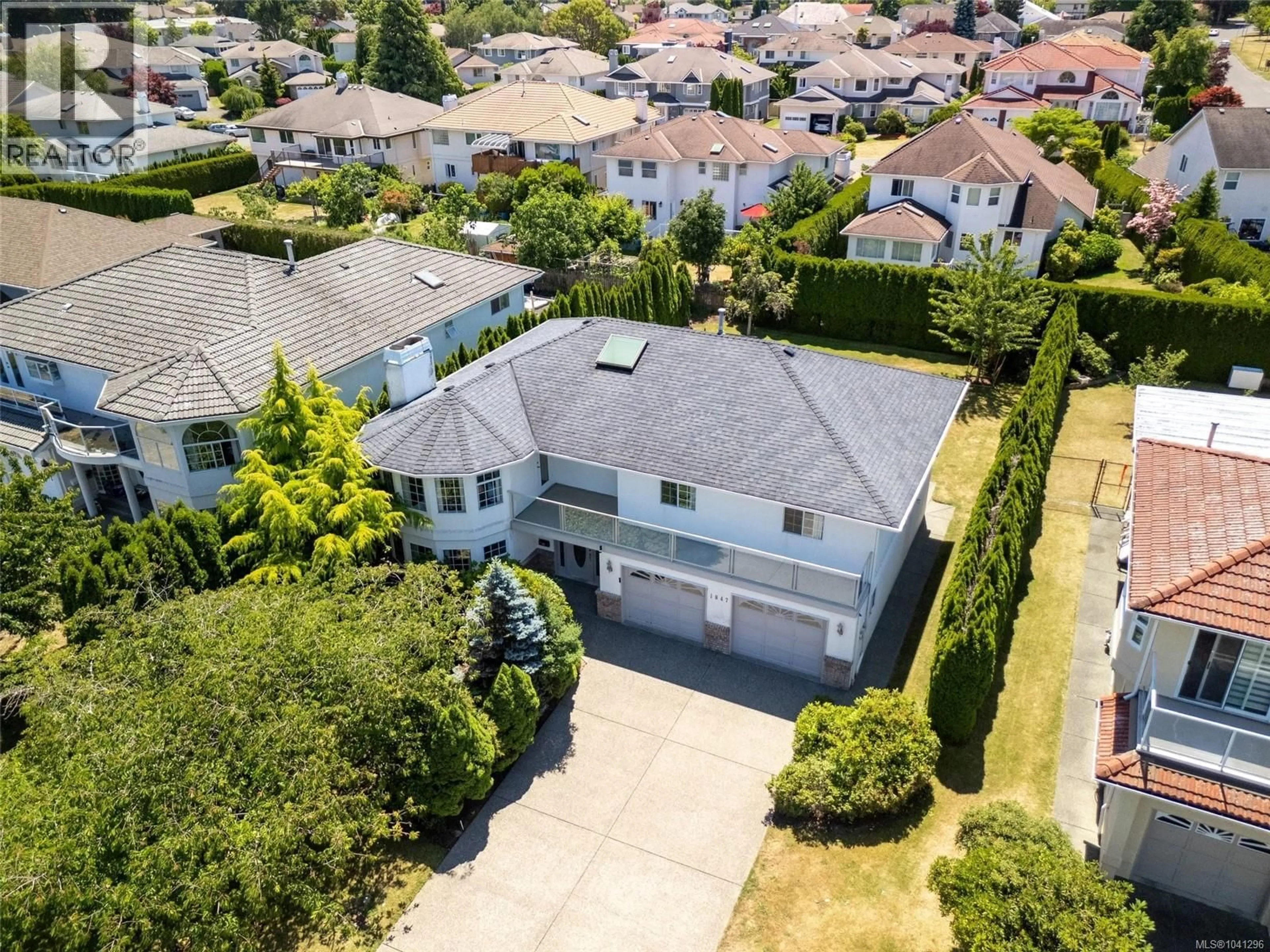 A pic from outside/outdoor area/front of a property/back of a property/a pic from drone, street for 1847 EL SERENO DRIVE, Saanich British Columbia V8N6K4