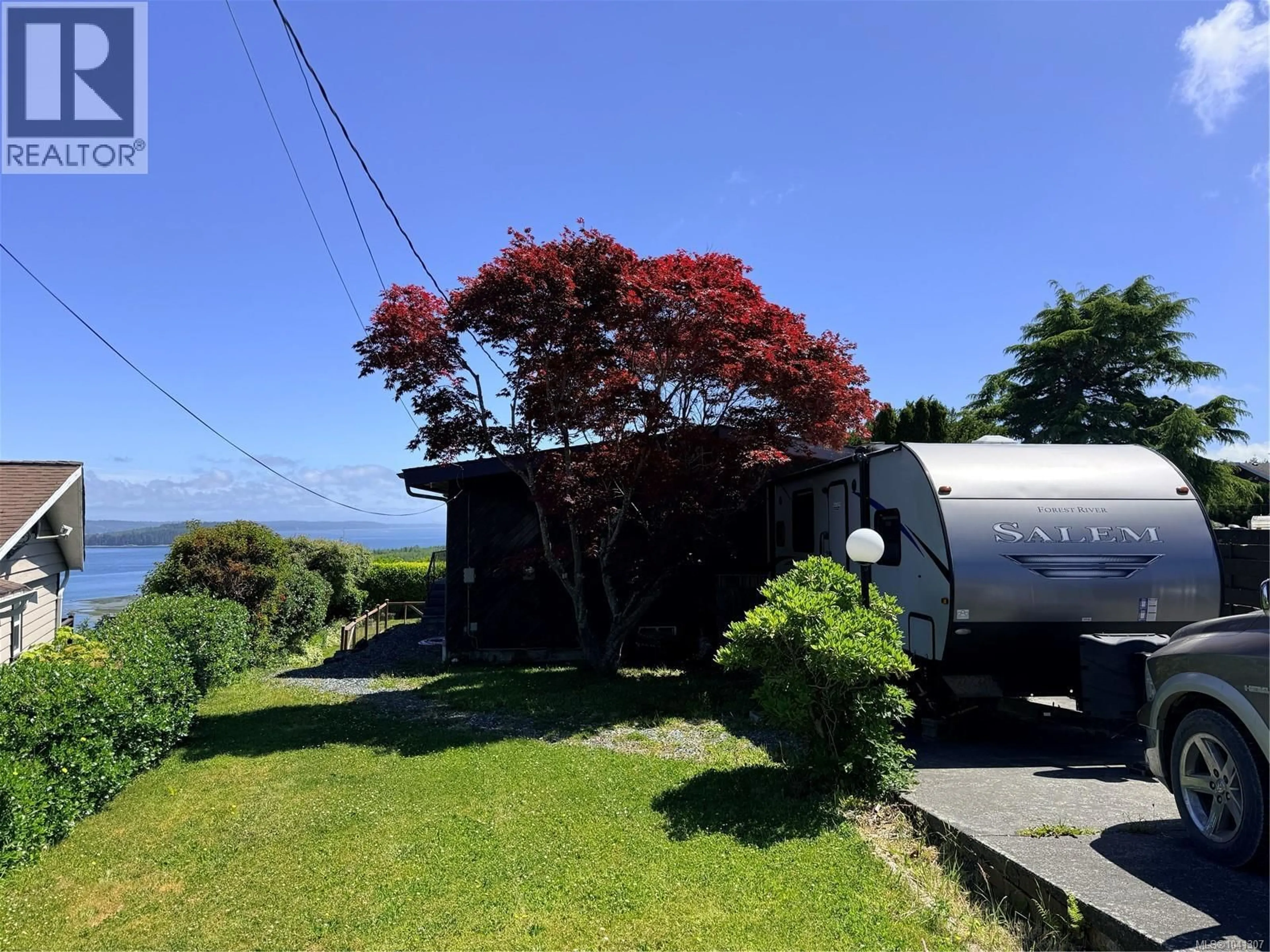 A pic from outside/outdoor area/front of a property/back of a property/a pic from drone, water/lake/river/ocean view for 2472 MOUNTVIEW ROAD, Port McNeill British Columbia V0N2R0
