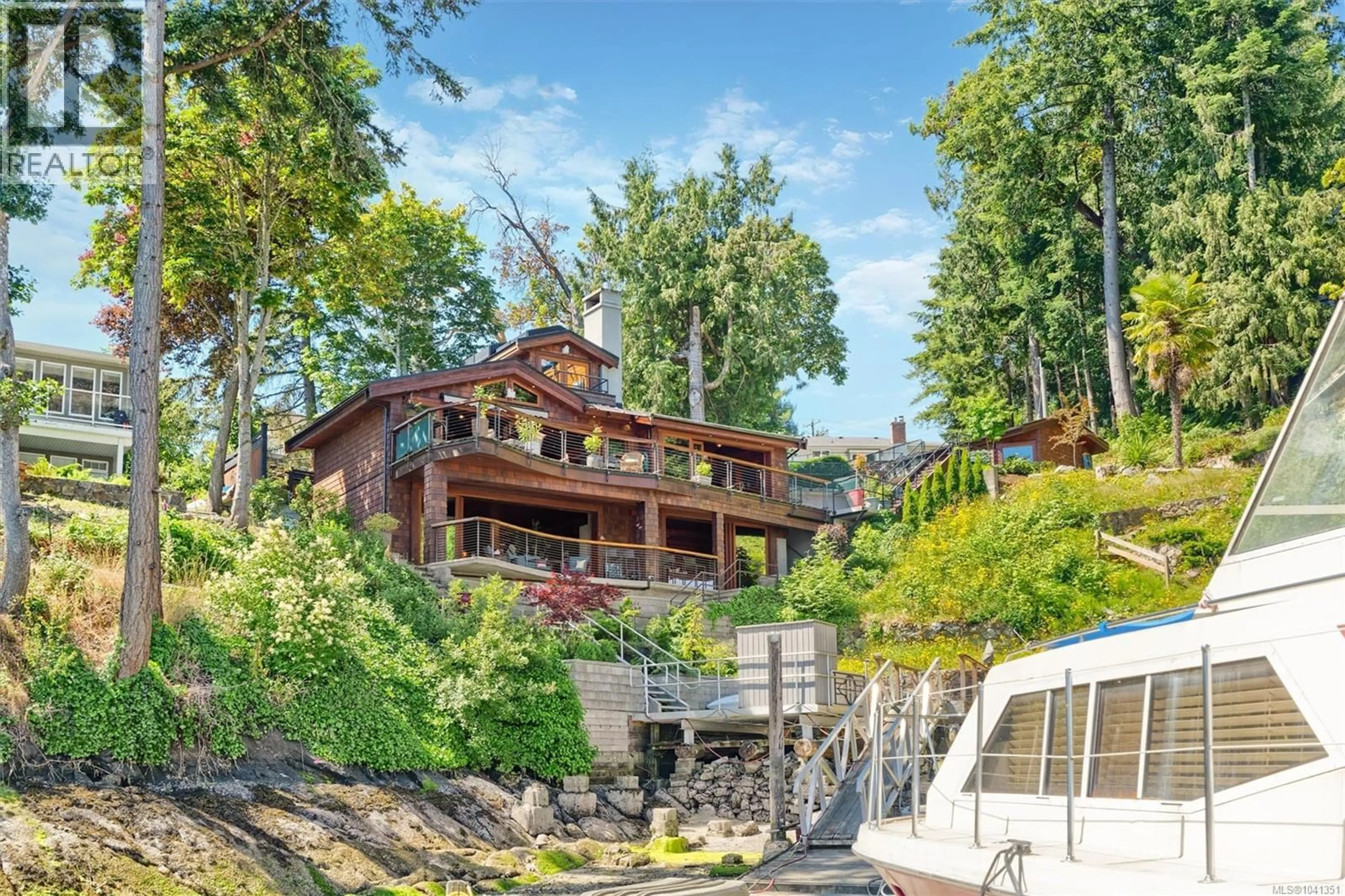 A pic from outside/outdoor area/front of a property/back of a property/a pic from drone, water/lake/river/ocean view for 10968 MADRONA DRIVE, North Saanich British Columbia V8R6K2