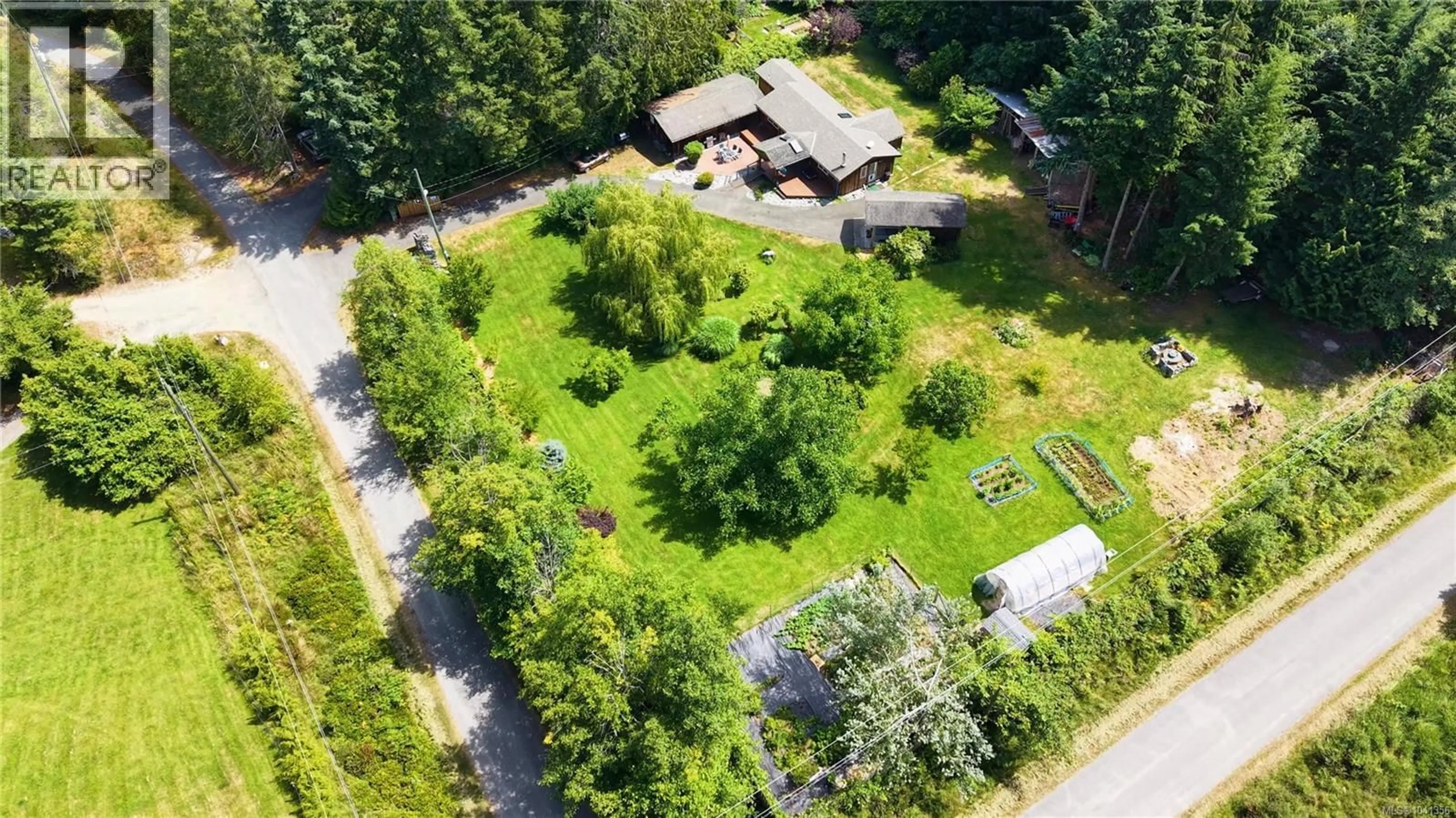 A pic from outside/outdoor area/front of a property/back of a property/a pic from drone, forest/trees view for 1107 KW'AS BAY ROAD, Cortes Island British Columbia V0P1K0