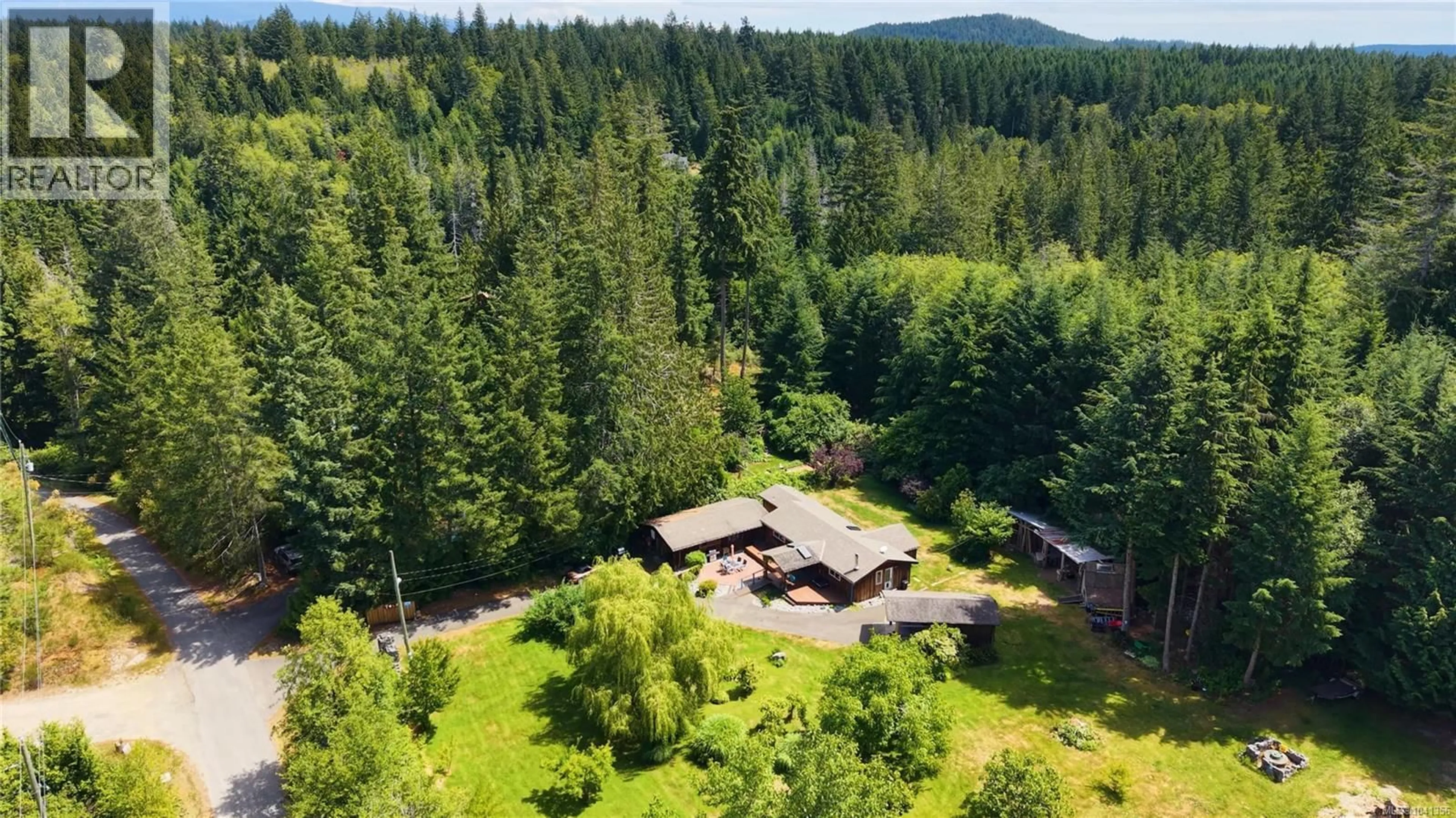 A pic from outside/outdoor area/front of a property/back of a property/a pic from drone, forest/trees view for 1107 KW'AS BAY ROAD, Cortes Island British Columbia V0P1K0
