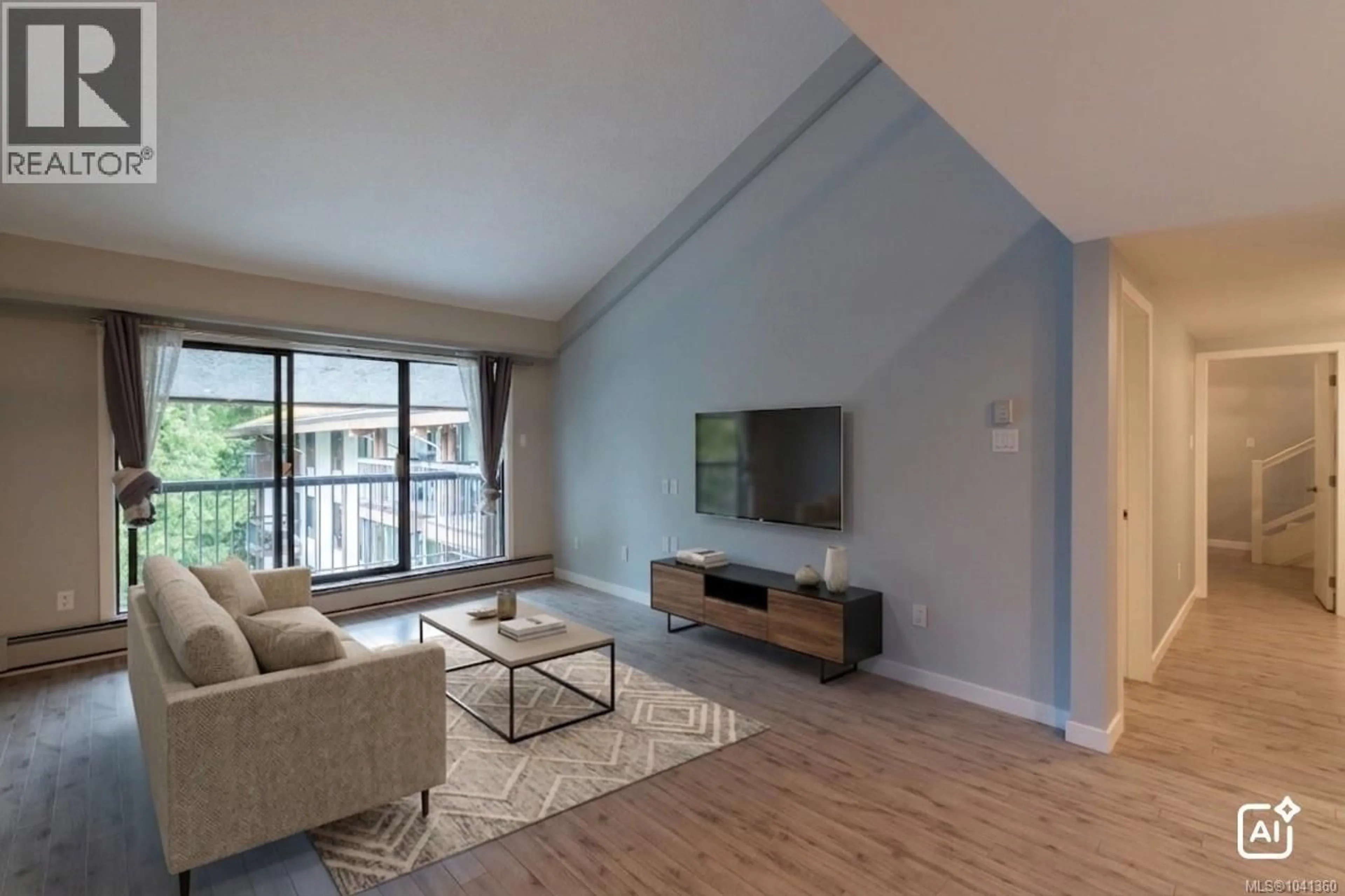 Living room with furniture, wood/laminate floor for 408 - 1005 MCKENZIE AVENUE, Saanich British Columbia V8X4A9