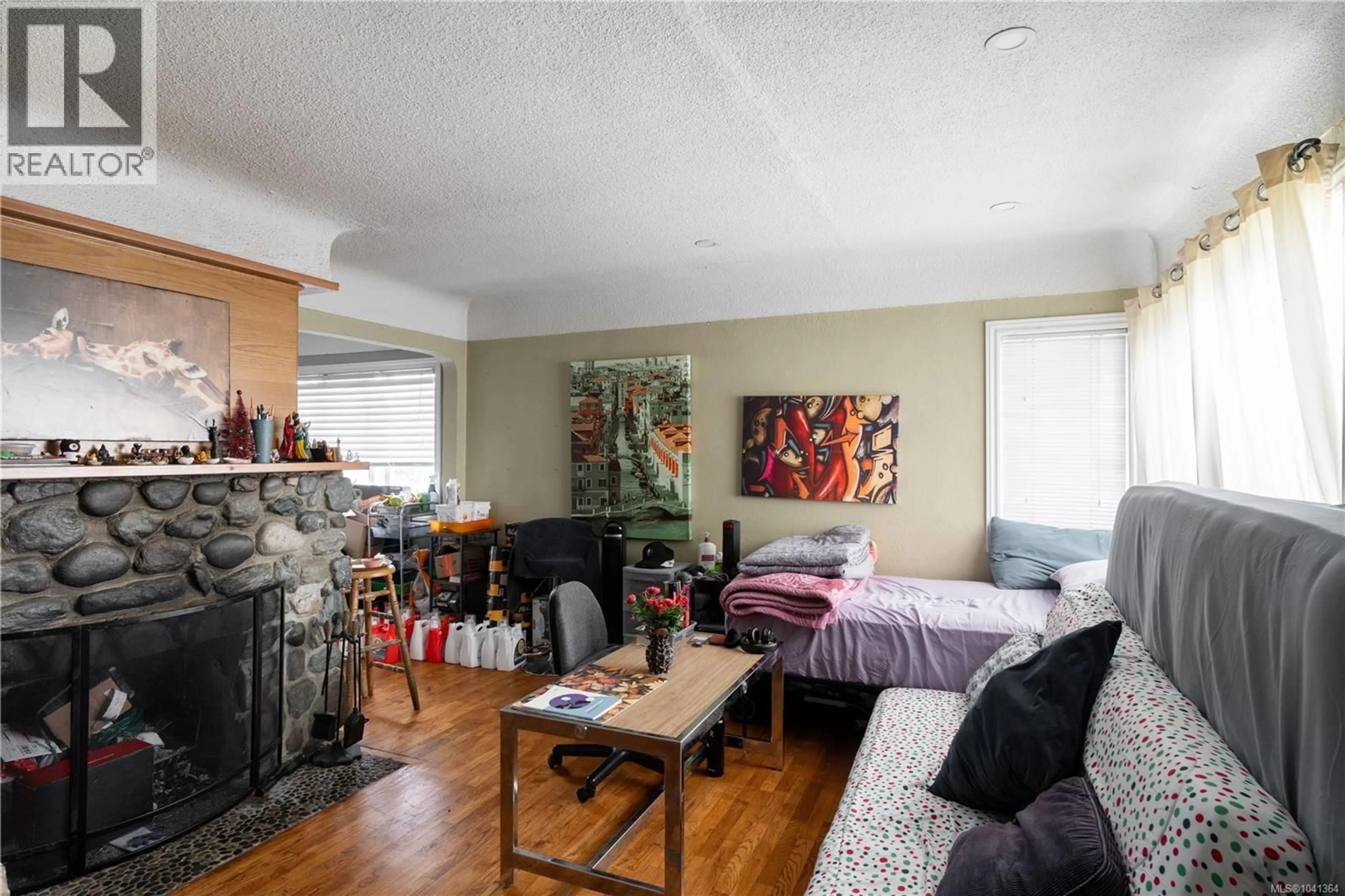 Living room with furniture, wood/laminate floor for 1203 PEARCE CRESCENT, Saanich British Columbia V8X3S8
