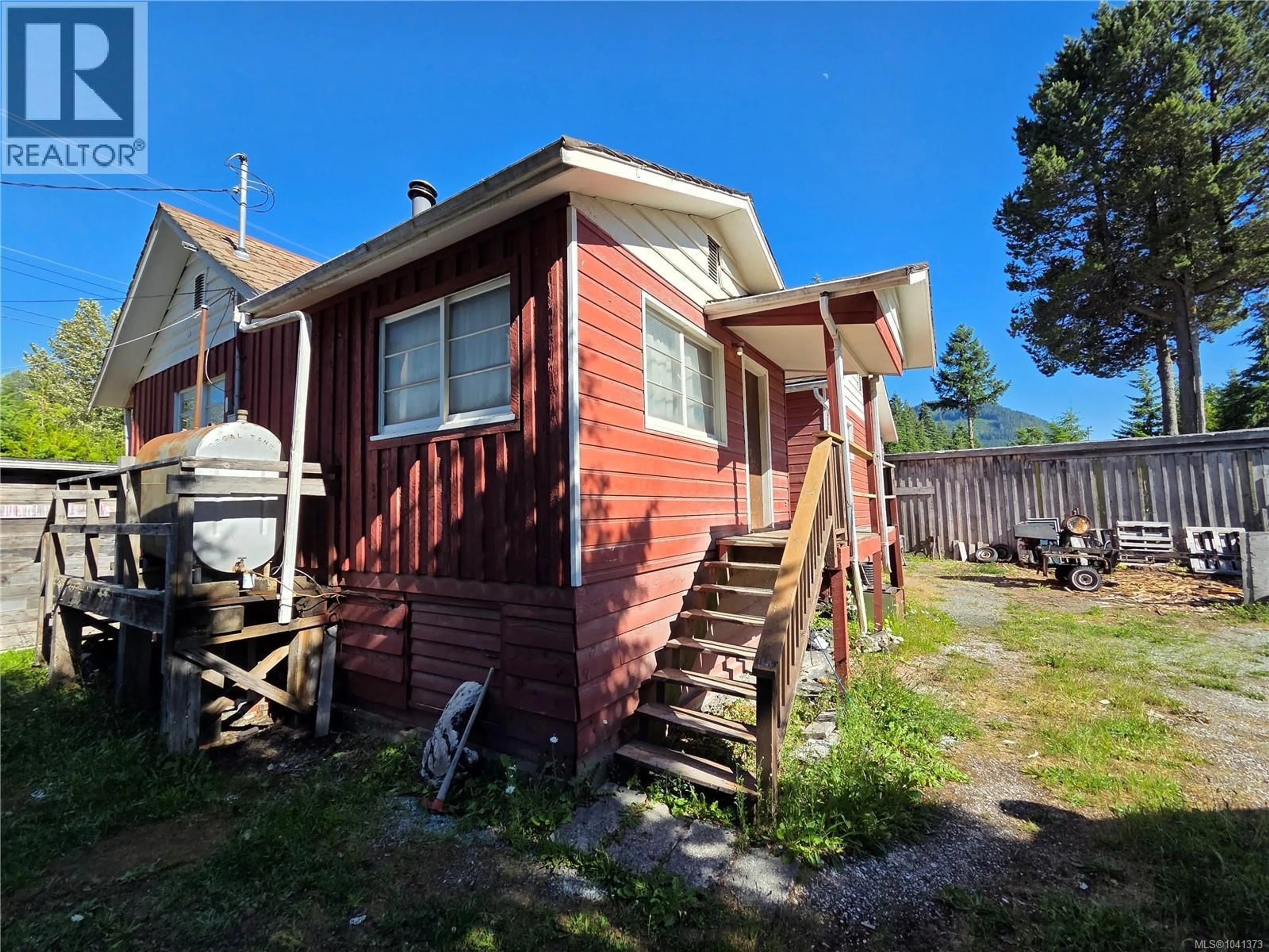 A pic from outside/outdoor area/front of a property/back of a property/a pic from drone, street for 62 KINMAN AVENUE, Woss British Columbia V0N3P0