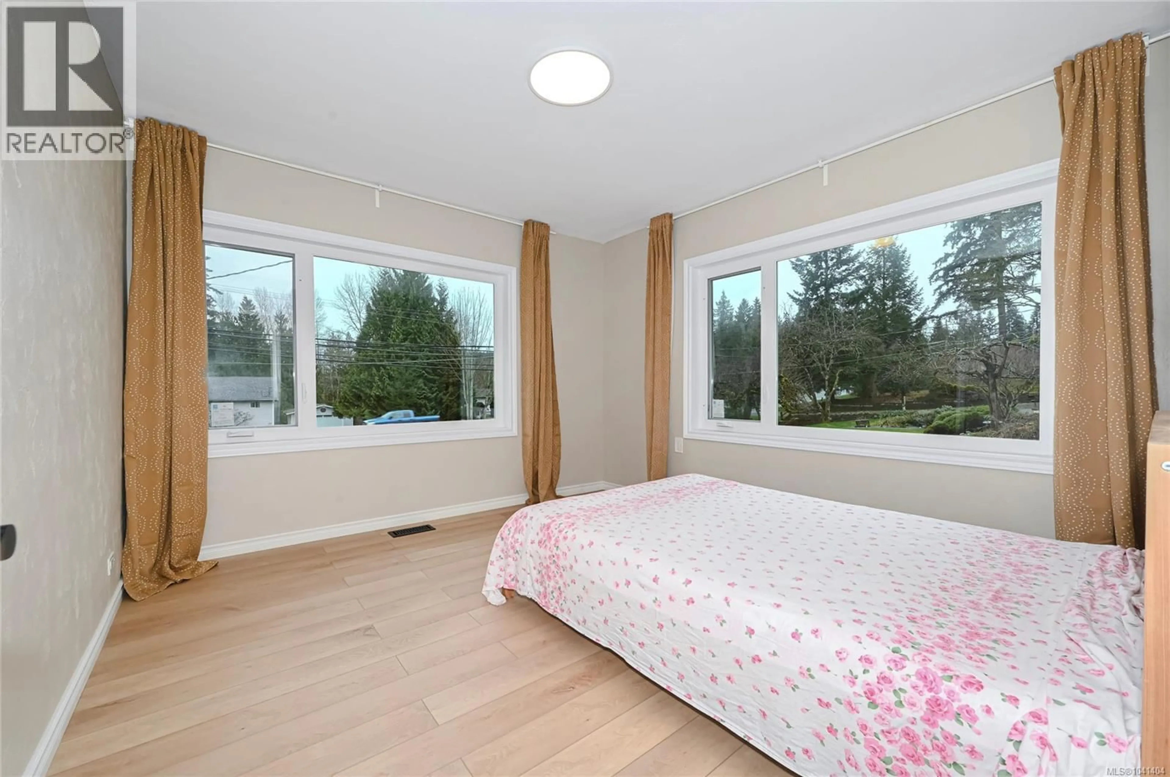 Bedroom with bed, wood/laminate floor for 1667 EXTENSION ROAD, Nanaimo British Columbia V9X1A5