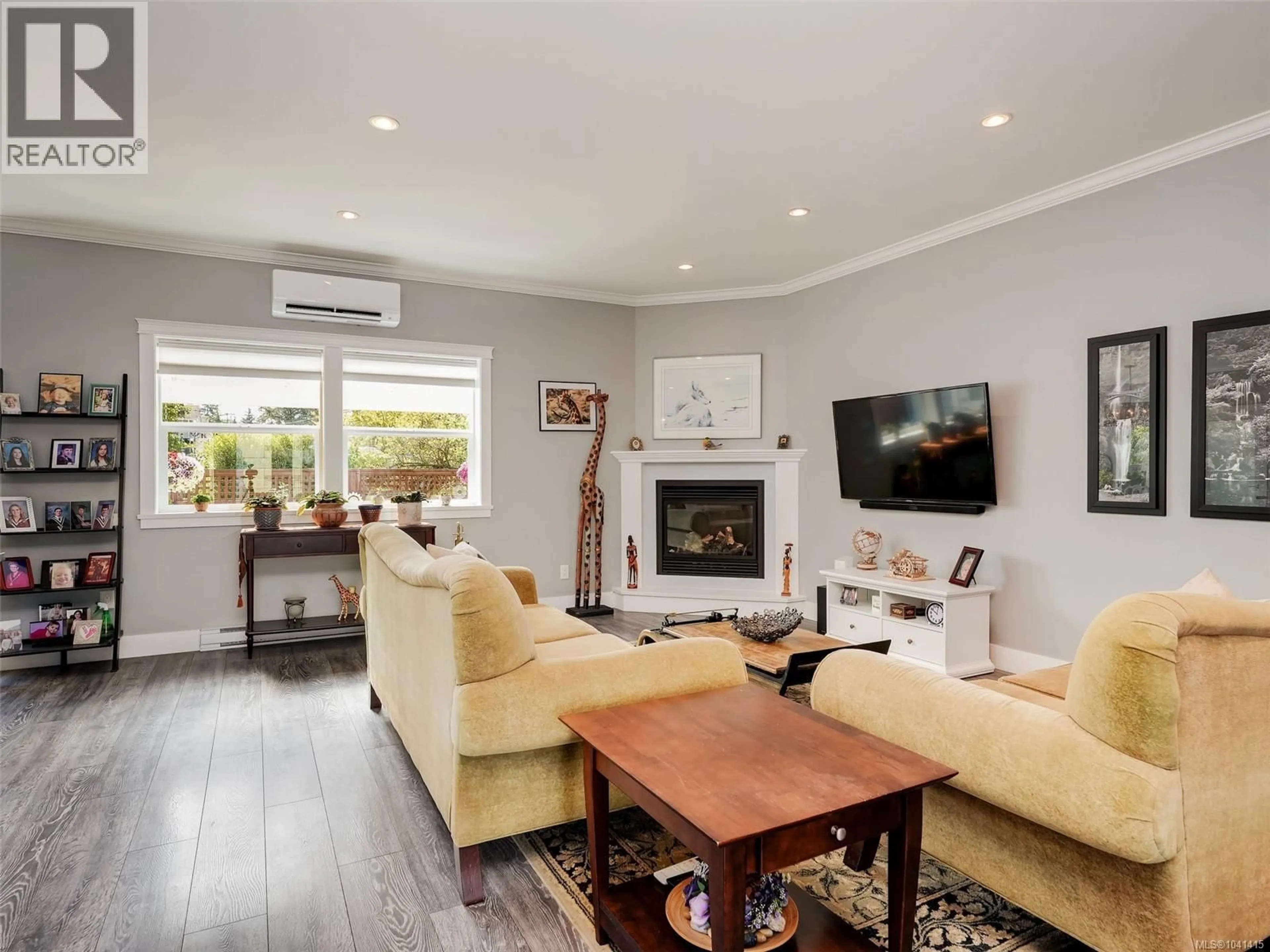 Living room with furniture, wood/laminate floor for 6889 LAURA'S LANE, Sooke British Columbia V9Z0P8