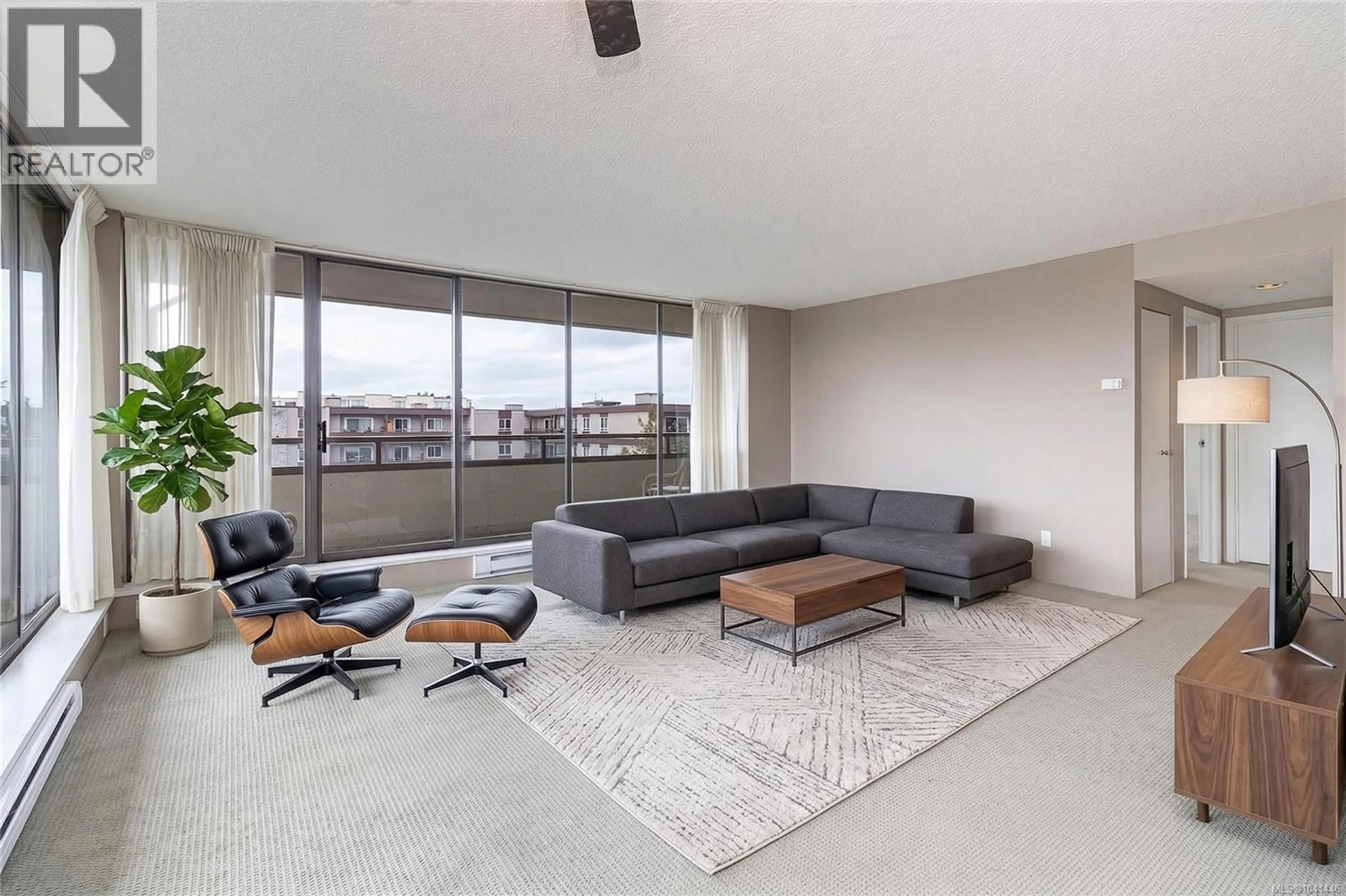 Living room with furniture, cement floor for 301 - 9805 SECOND STREET, Sidney British Columbia V8L4T9