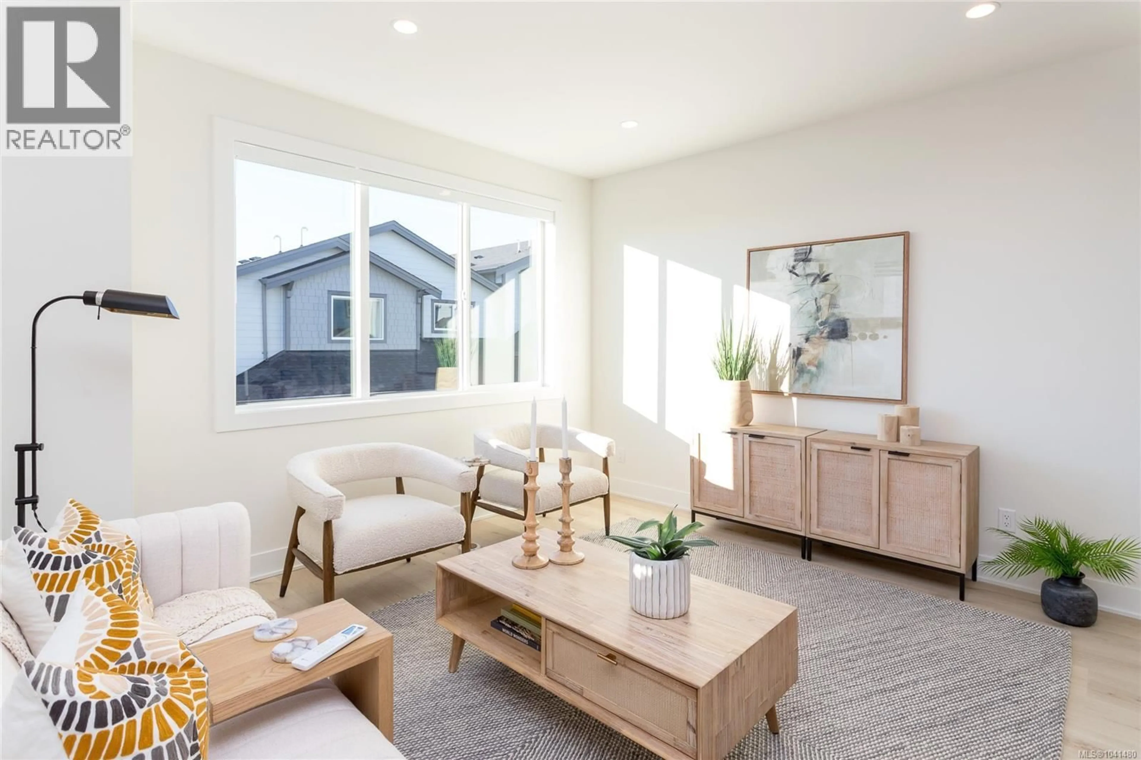 Living room with furniture, wood/laminate floor for 1405 DOLOMITE RIDGE, Langford British Columbia V9B7G1