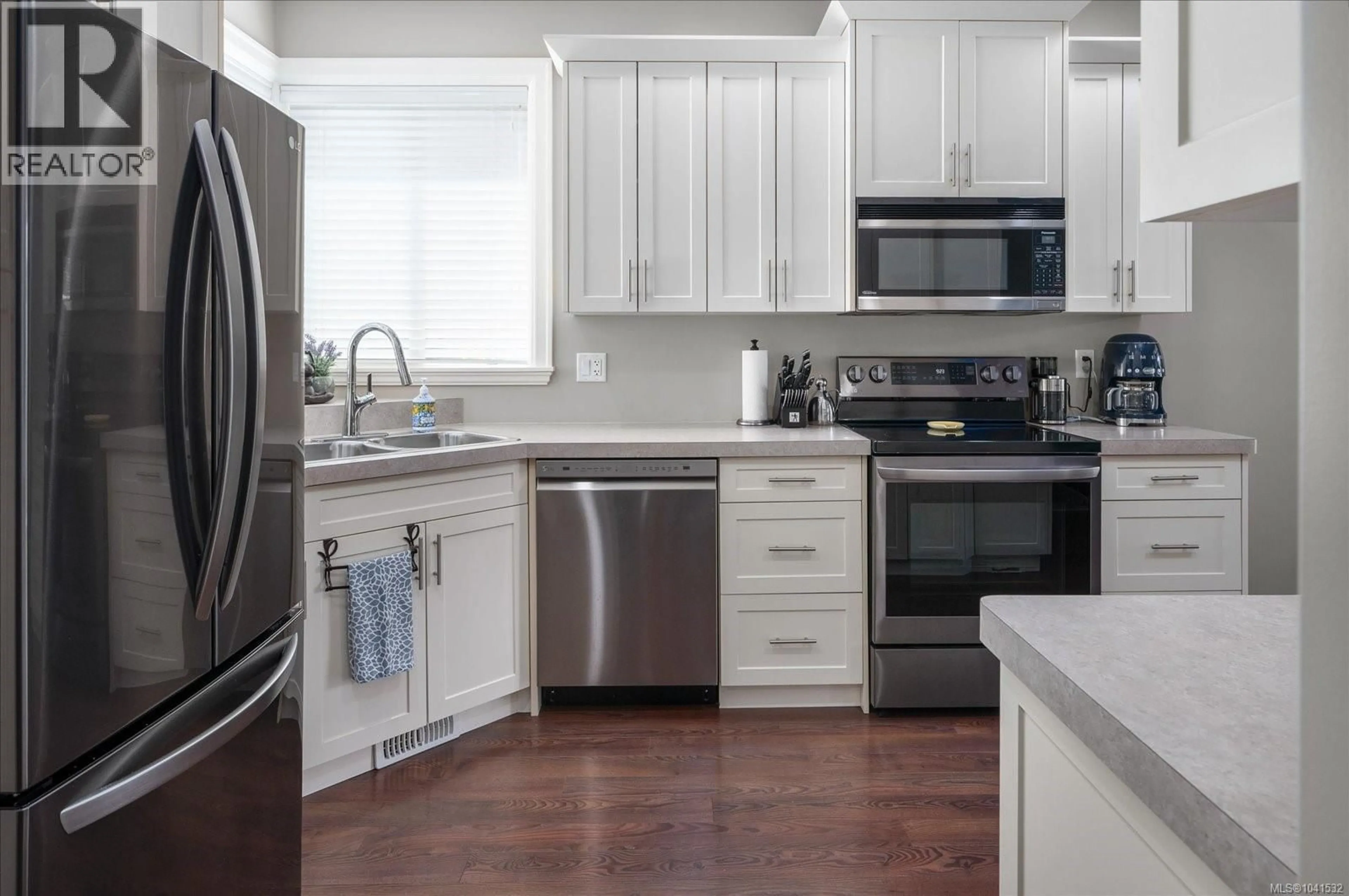 Open concept kitchen, ceramic/tile floor for 101 - 5934 KADEN PLACE, Nanaimo British Columbia V9T0B5