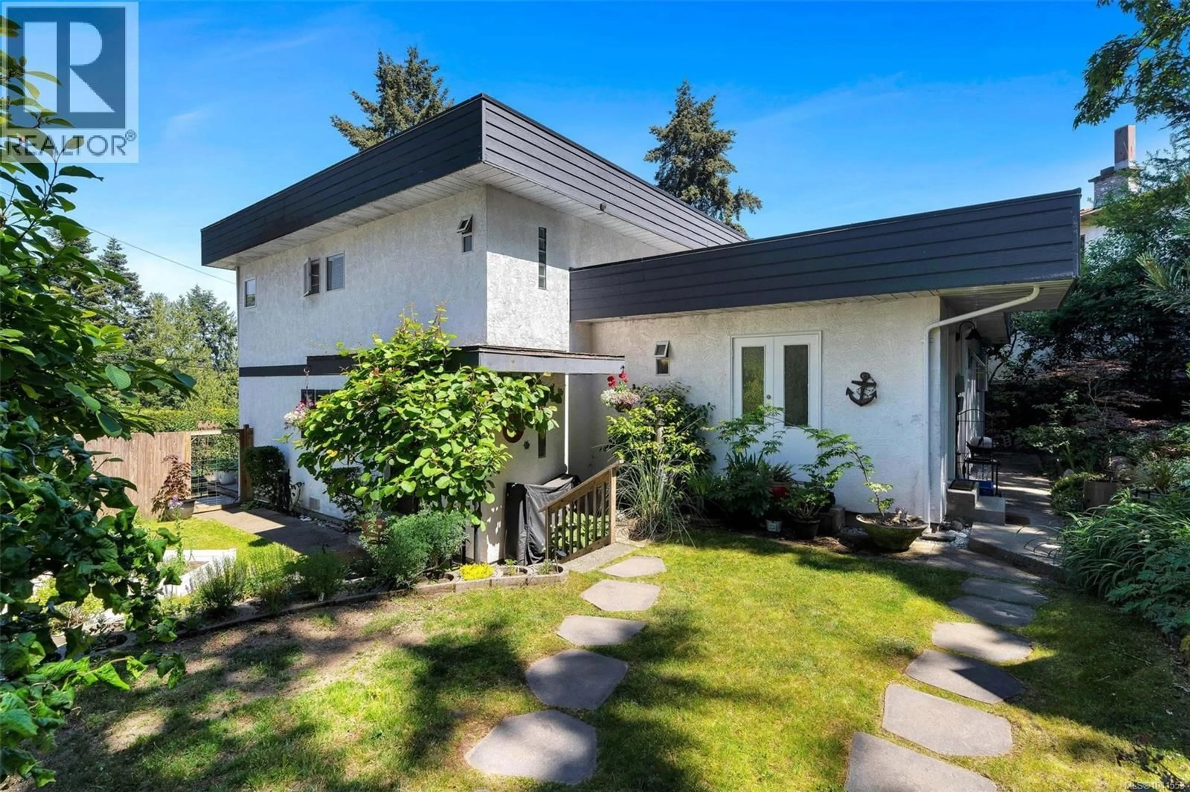 Home with vinyl exterior material, street for 2635 MILL BAY ROAD, Mill Bay British Columbia V8H1C9