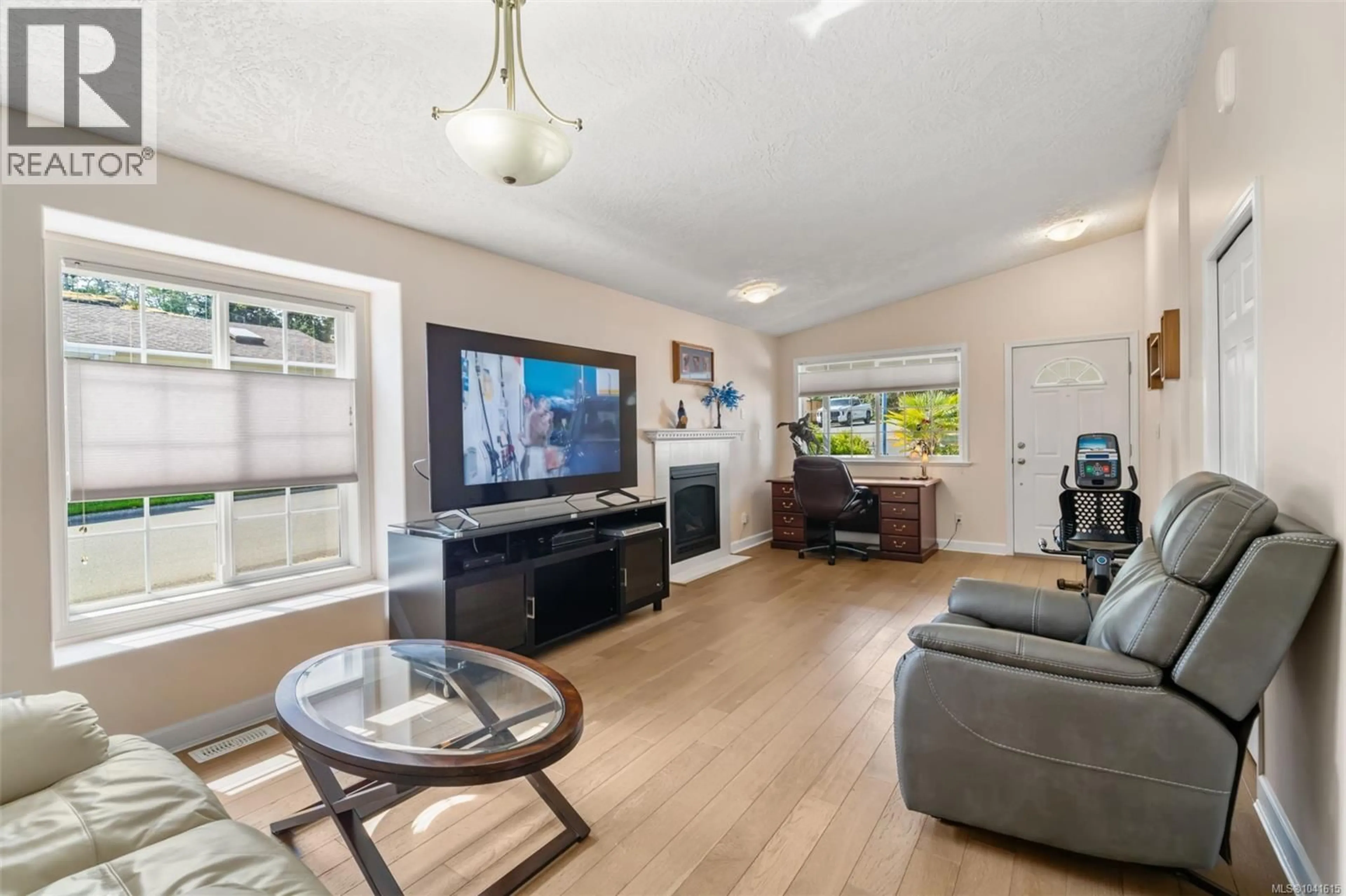 Living room with furniture, wood/laminate floor for 38 EAGLE LANE, View Royal British Columbia V9A7M2