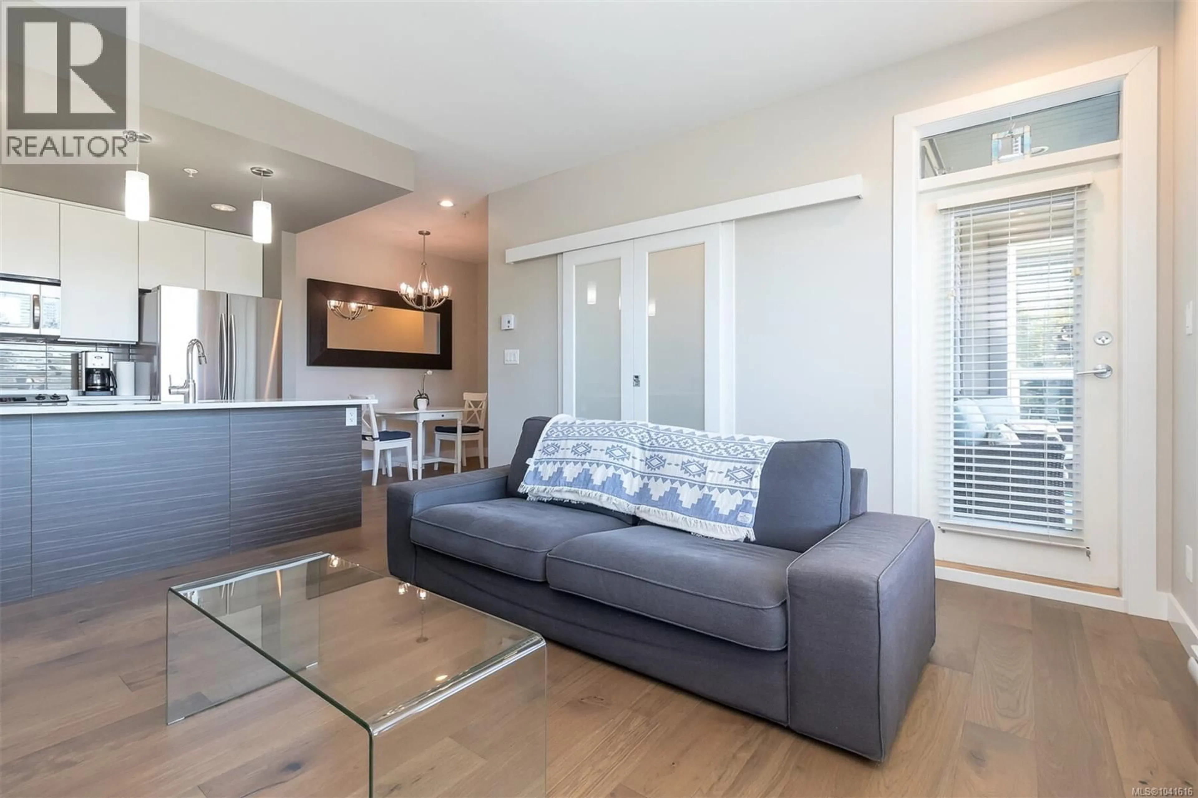Living room with furniture, wood/laminate floor for 203 - 1008 TILLICUM ROAD, Esquimalt British Columbia V9A1Z8