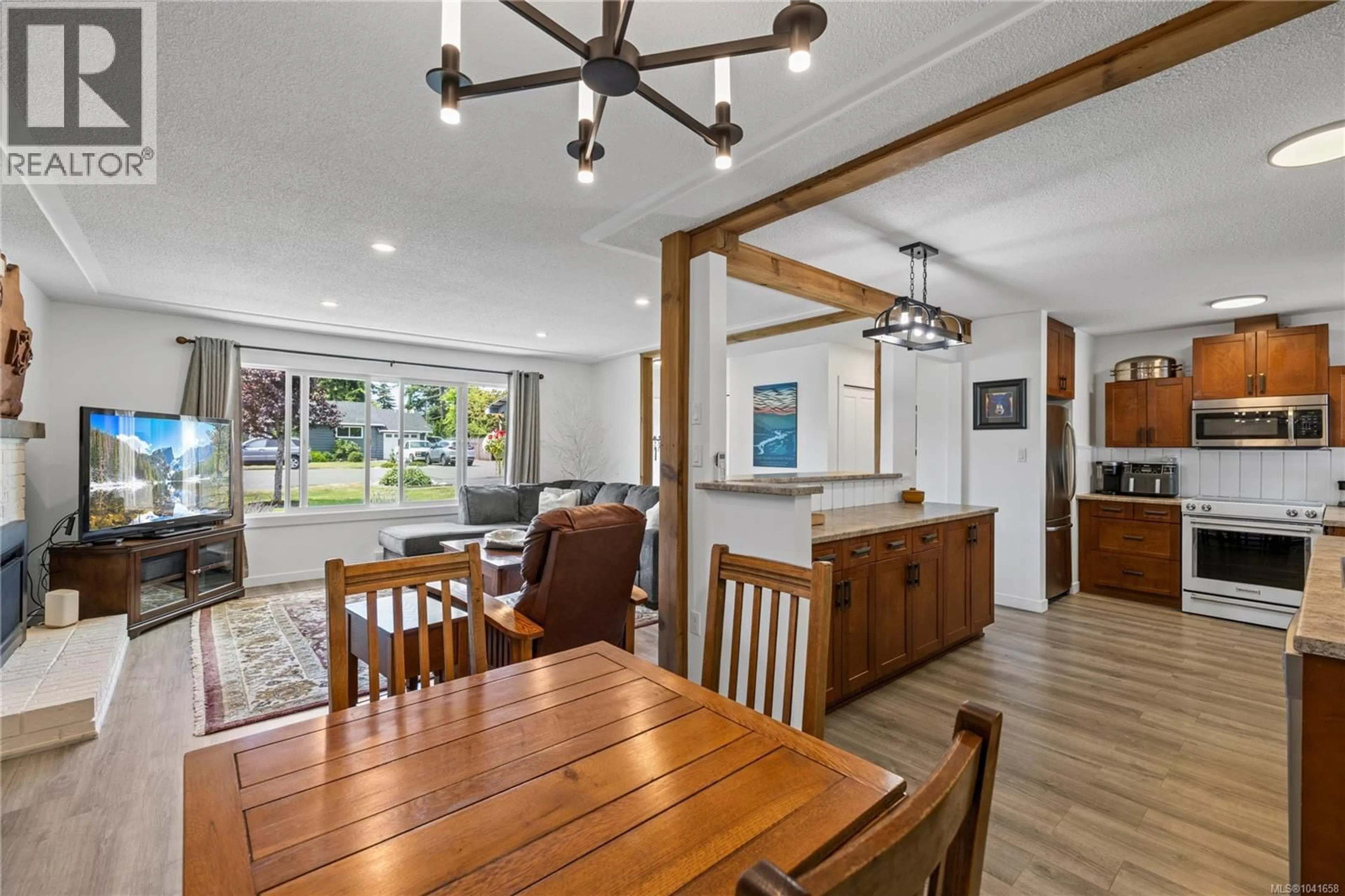 Open concept kitchen, wood/laminate floor for 16 SANGSTER PLACE, Parksville British Columbia V9P1G4