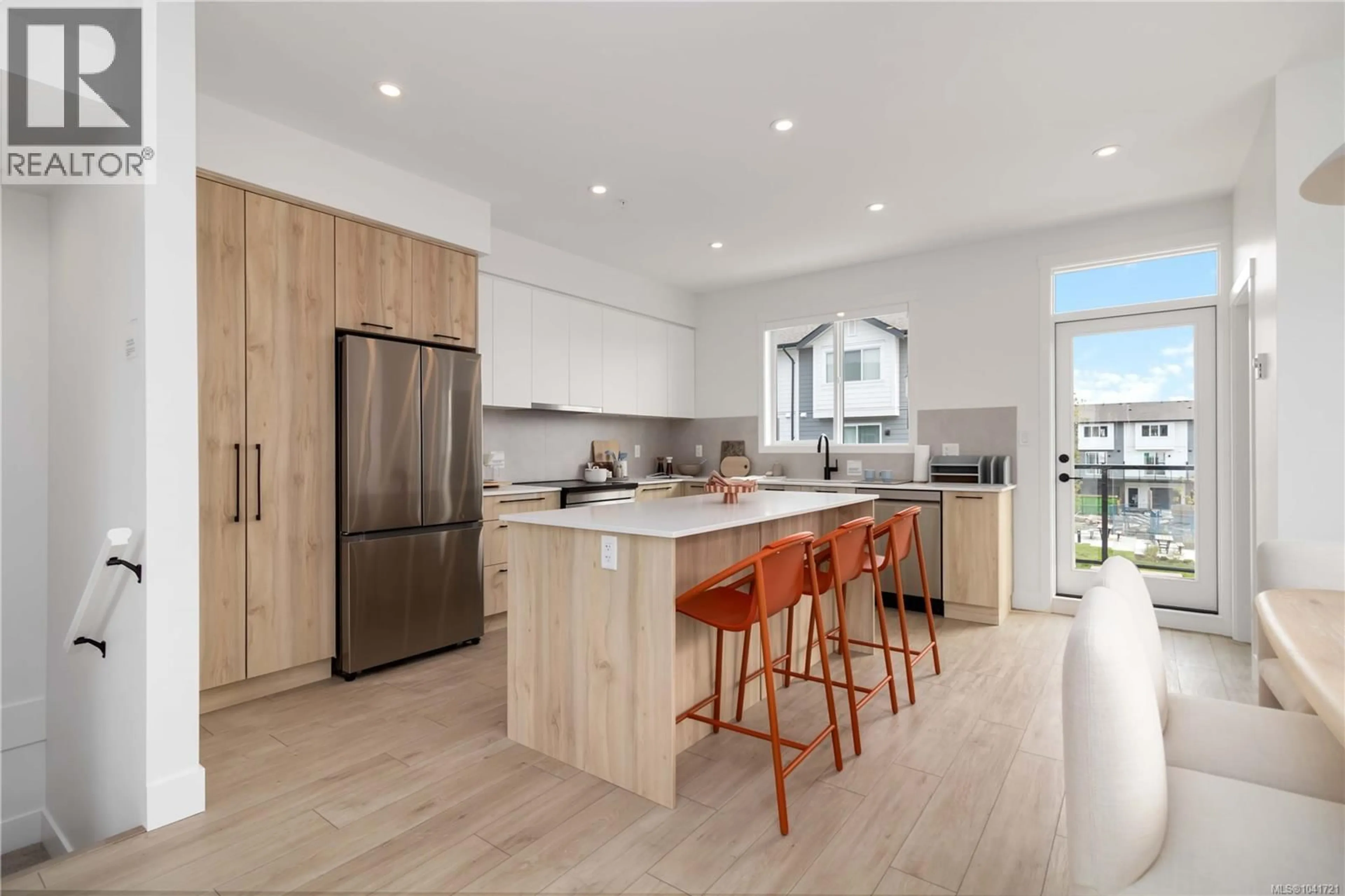 Open concept kitchen, wood/laminate floor for 81 - 368 TRADEWINDS AVENUE, Colwood British Columbia V9C0S5