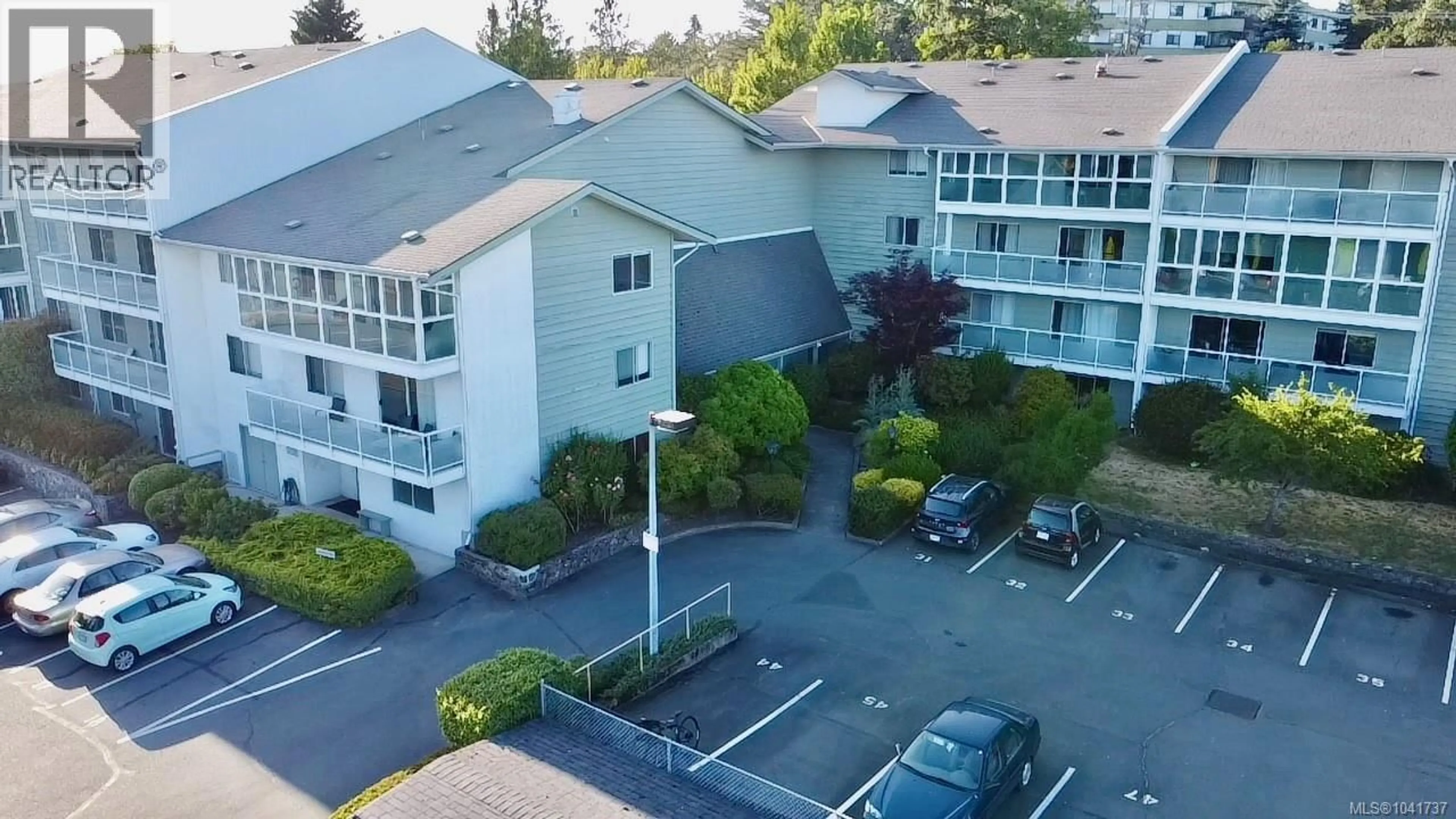 A pic from outside/outdoor area/front of a property/back of a property/a pic from drone, unknown for 312 - 1490 GARNET ROAD, Saanich British Columbia V8P5L1