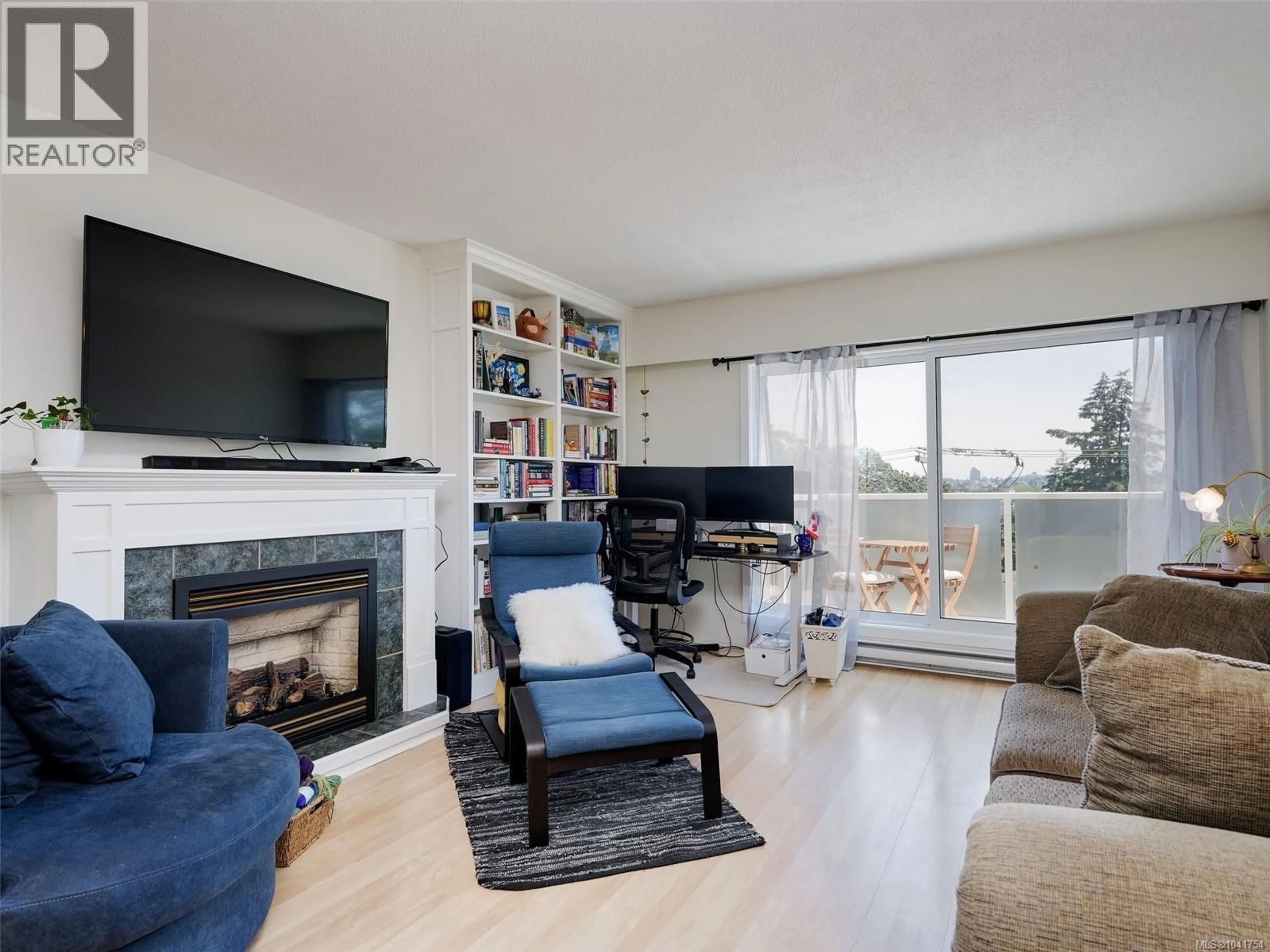 Living room with furniture, wood/laminate floor for 405 - 710 LAMPSON STREET, Esquimalt British Columbia V9A6A6